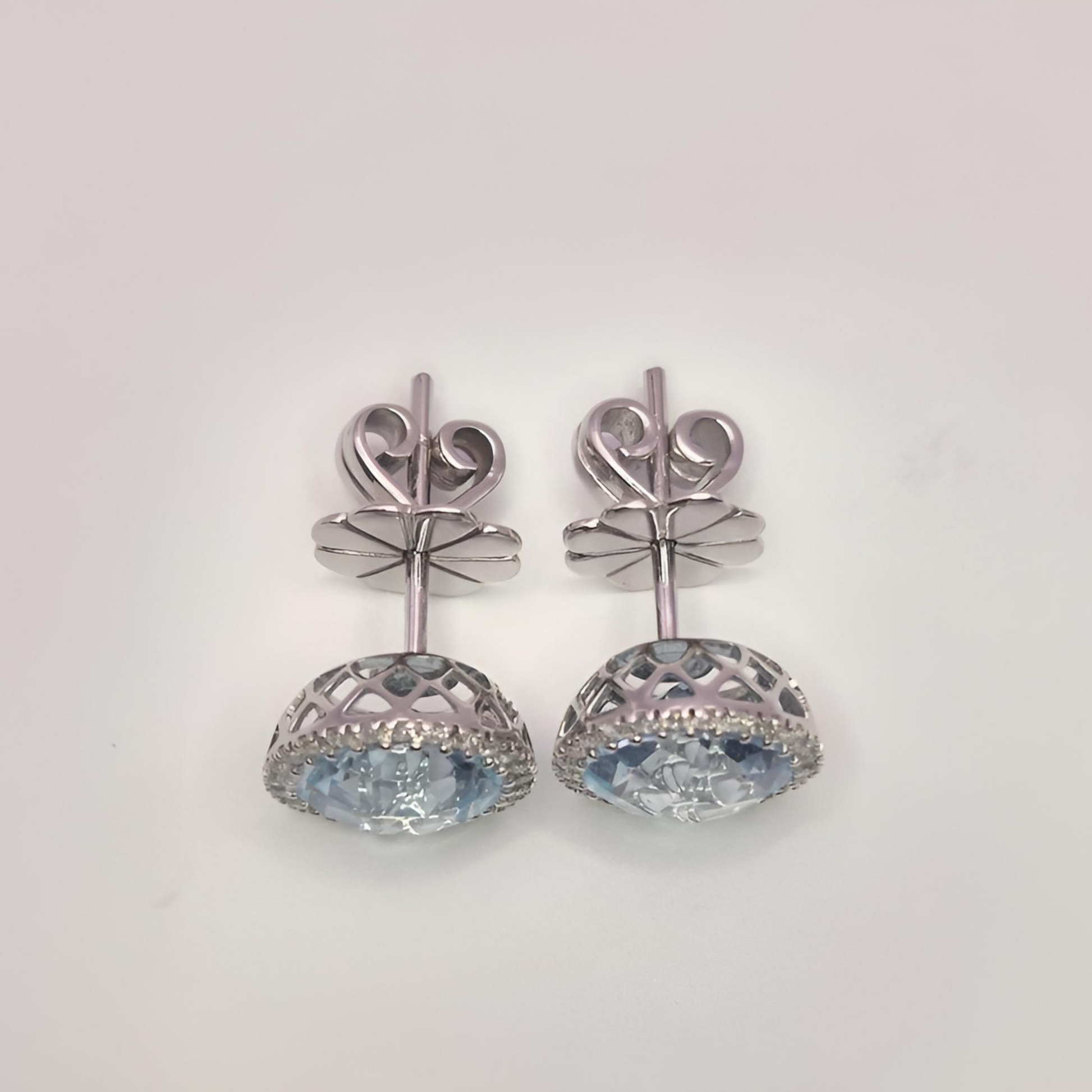 18ct white gold aquamarine and diamond halo cluster earrings above view