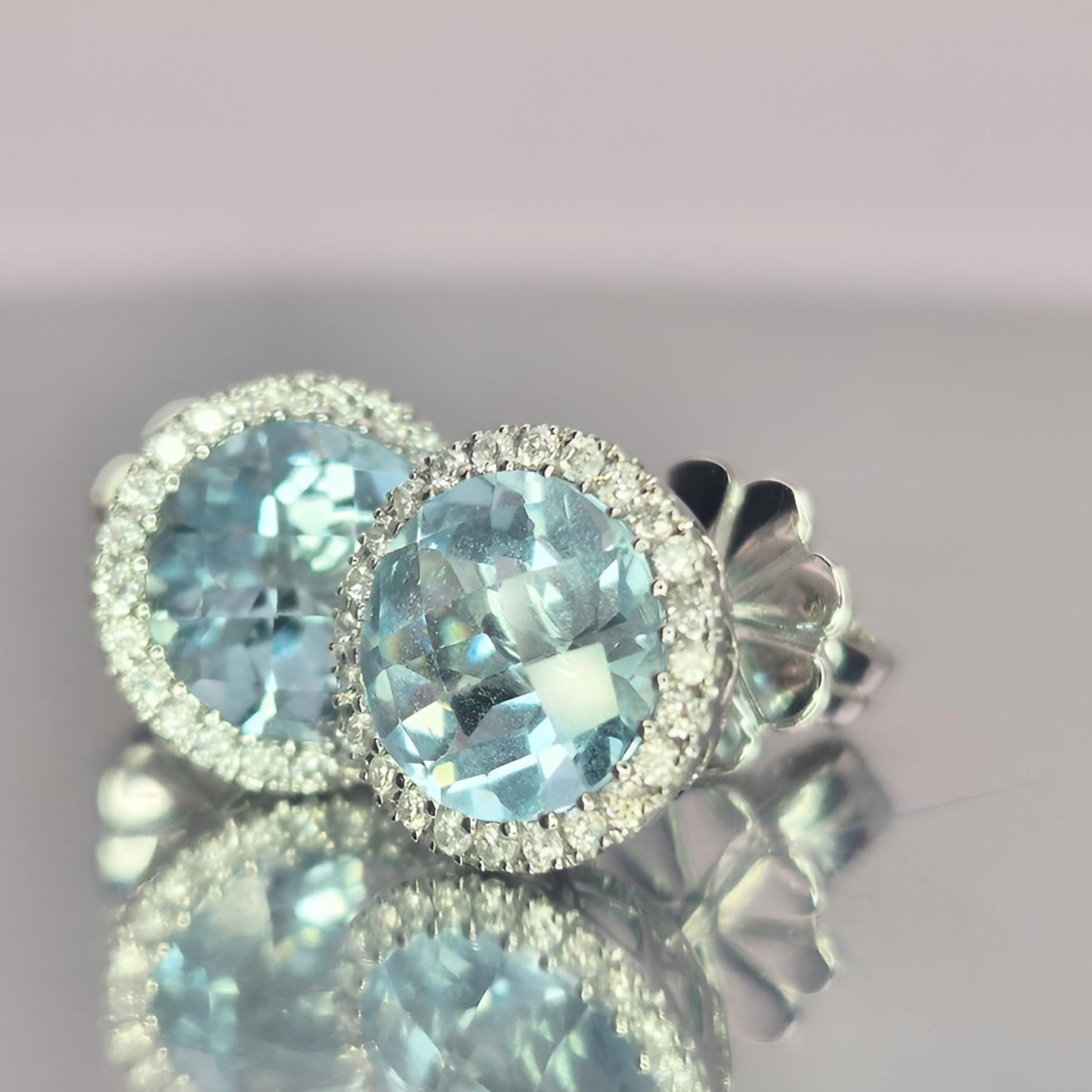 18ct white gold hallmarked aquamarine and diamond halo cluster earrings side