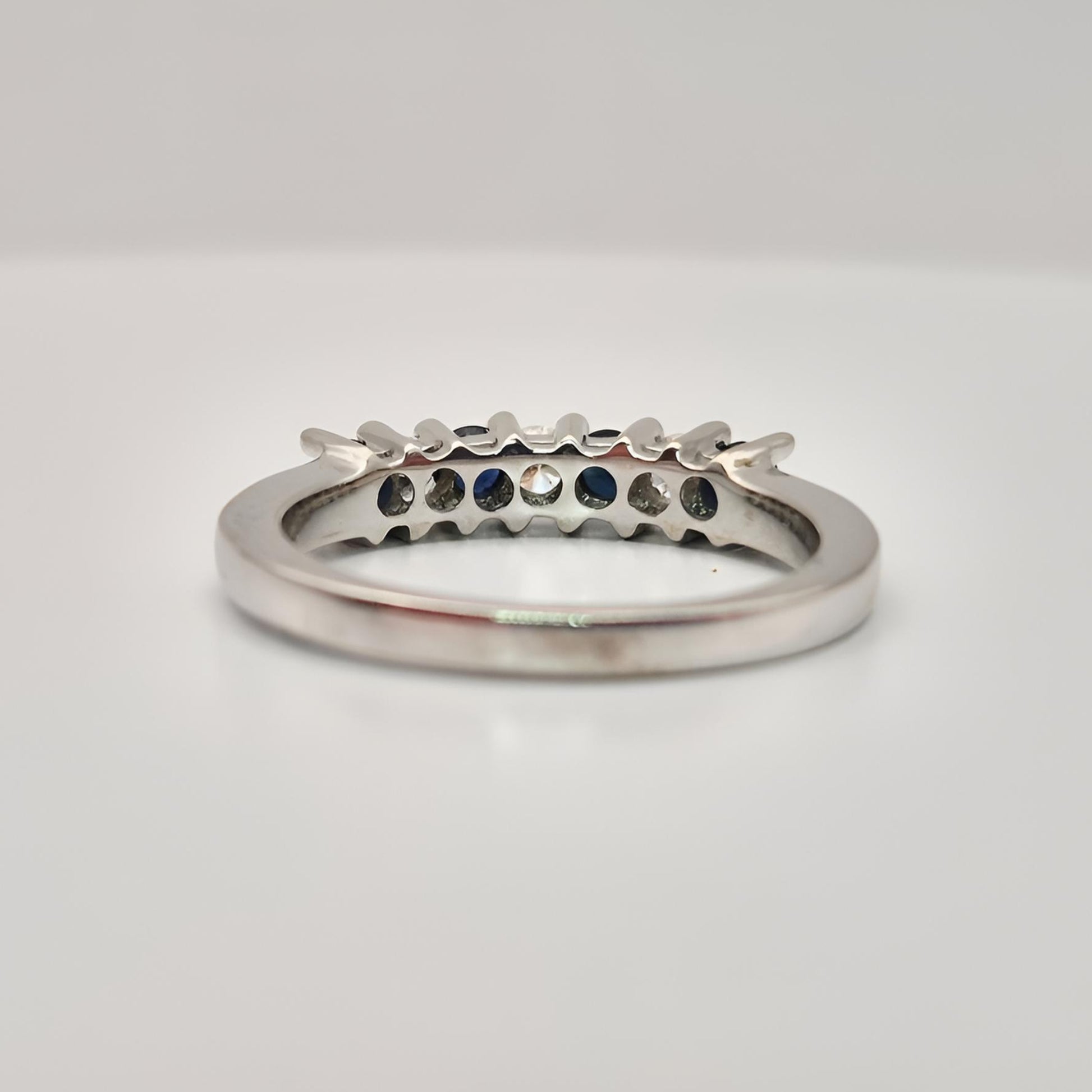 18ct white gold seven stone sapphire diamond half eternity ring behind view