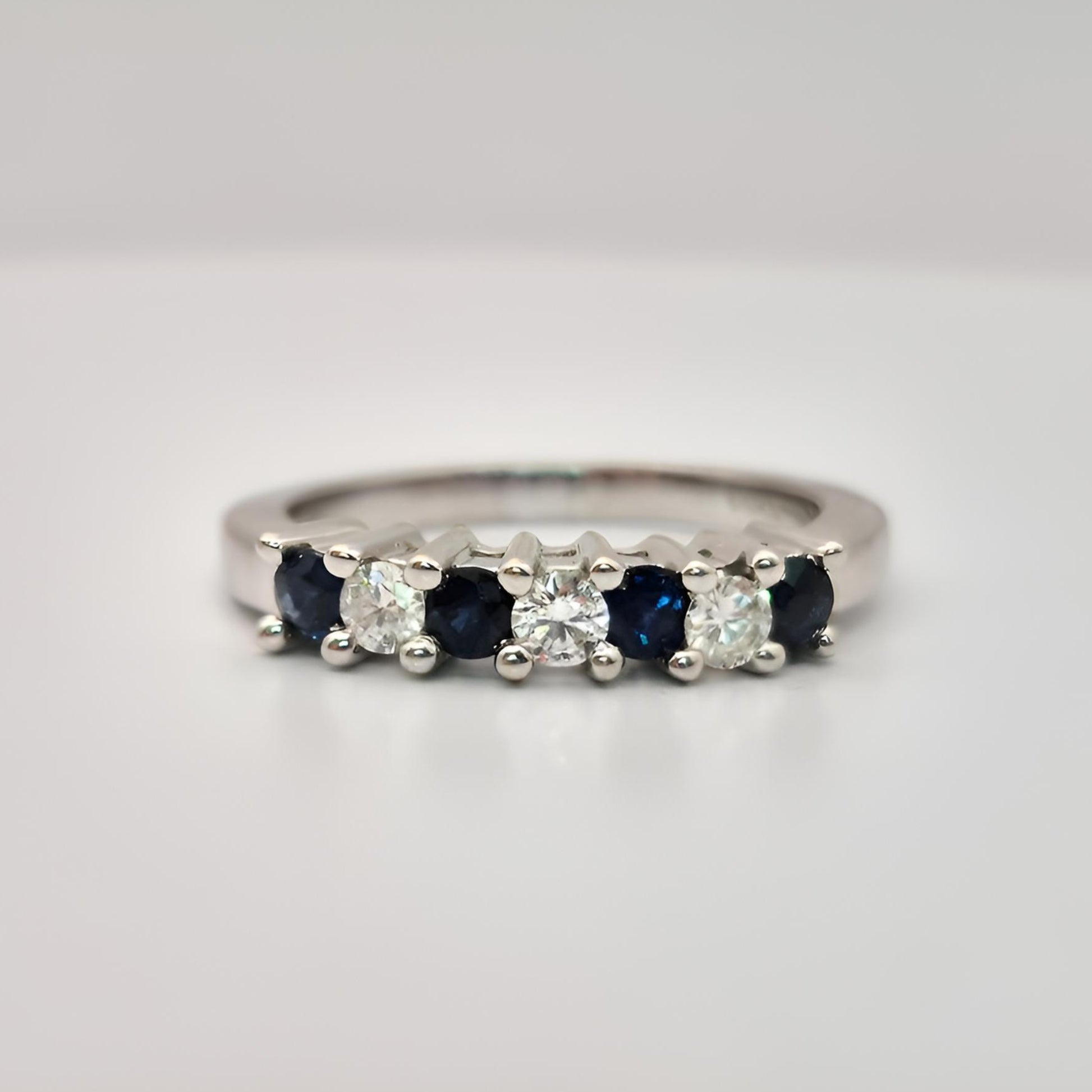18ct white gold seven stone sapphire diamond half eternity ring front