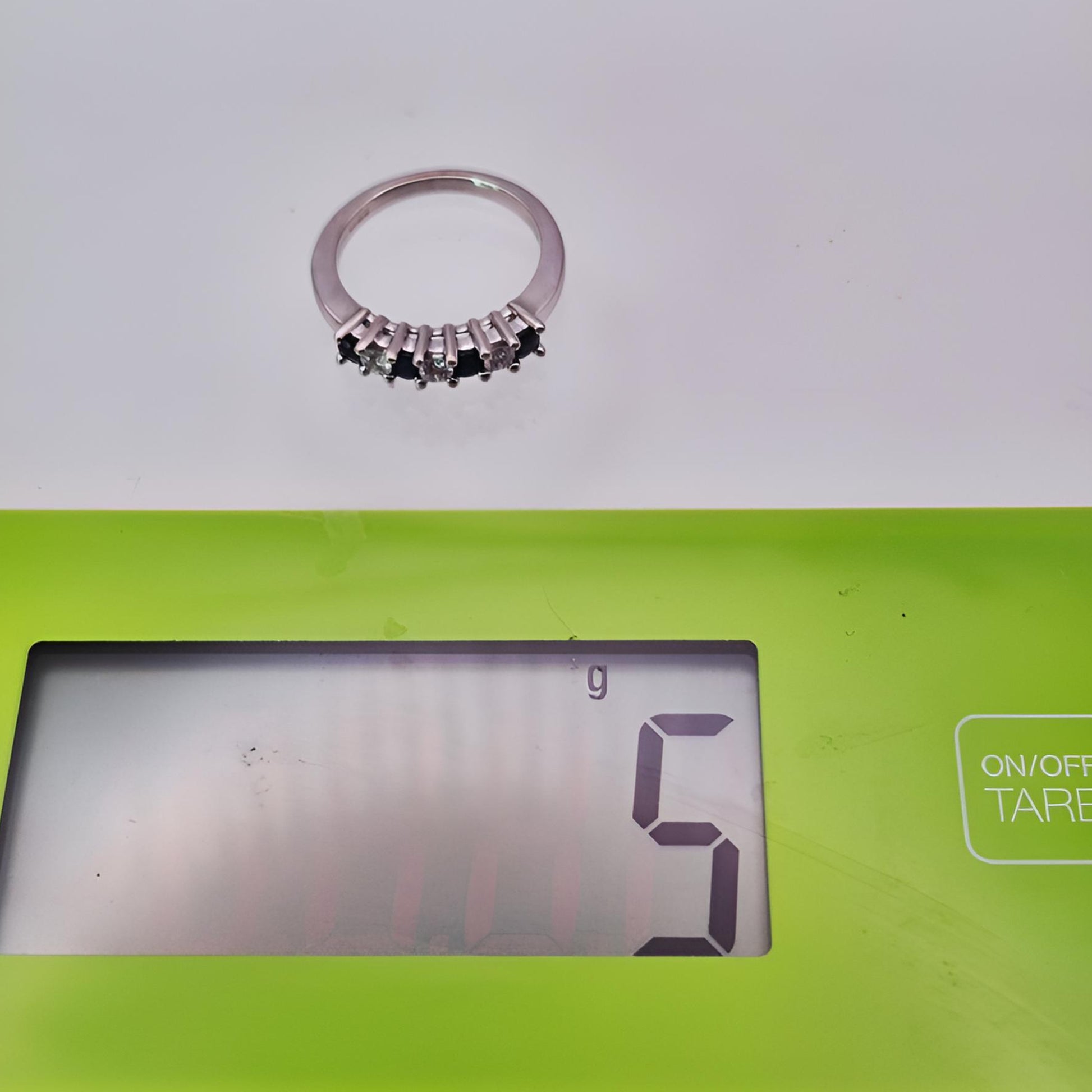 18ct white gold seven stone sapphire diamond half eternity ring weight on scale