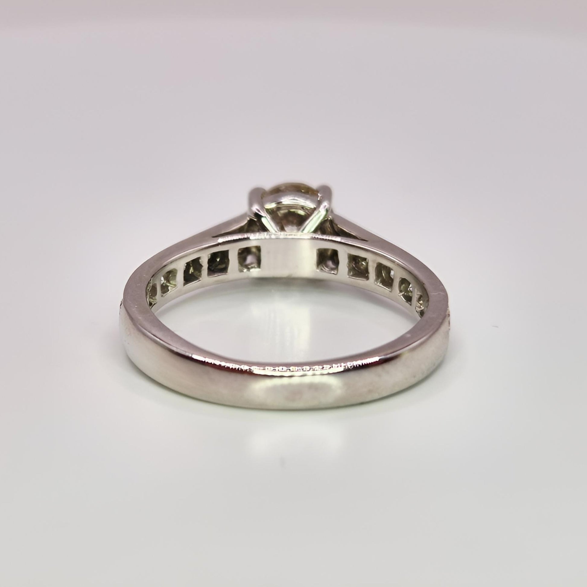18ct white gold single stone diamond shoulders ring from above behind