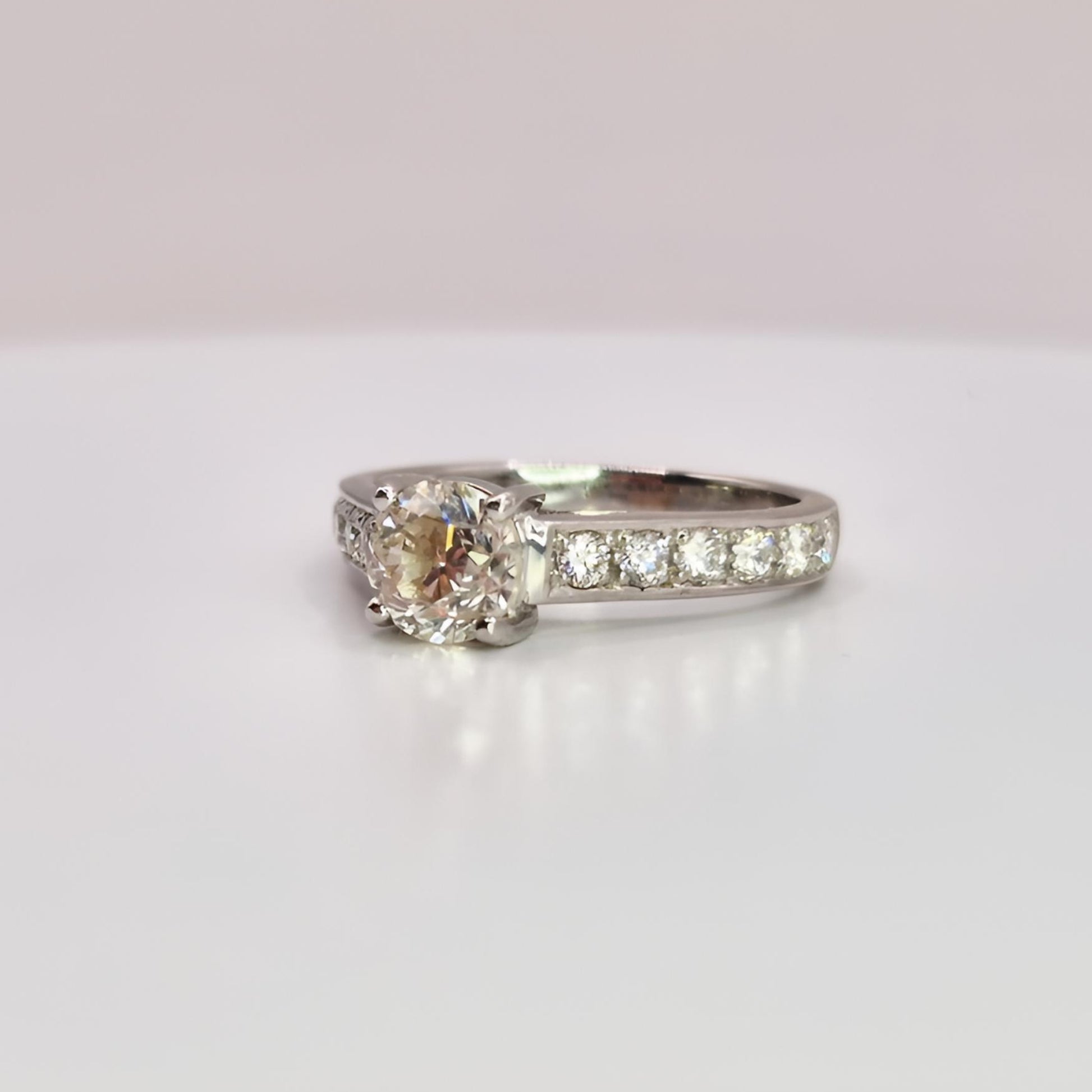 18ct white gold single stone diamond shoulders ring from left angle