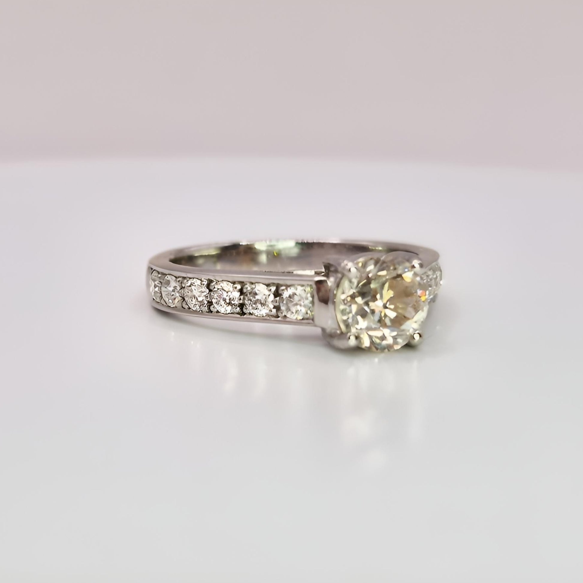 18ct white gold single stone diamond shoulders ring from right angle