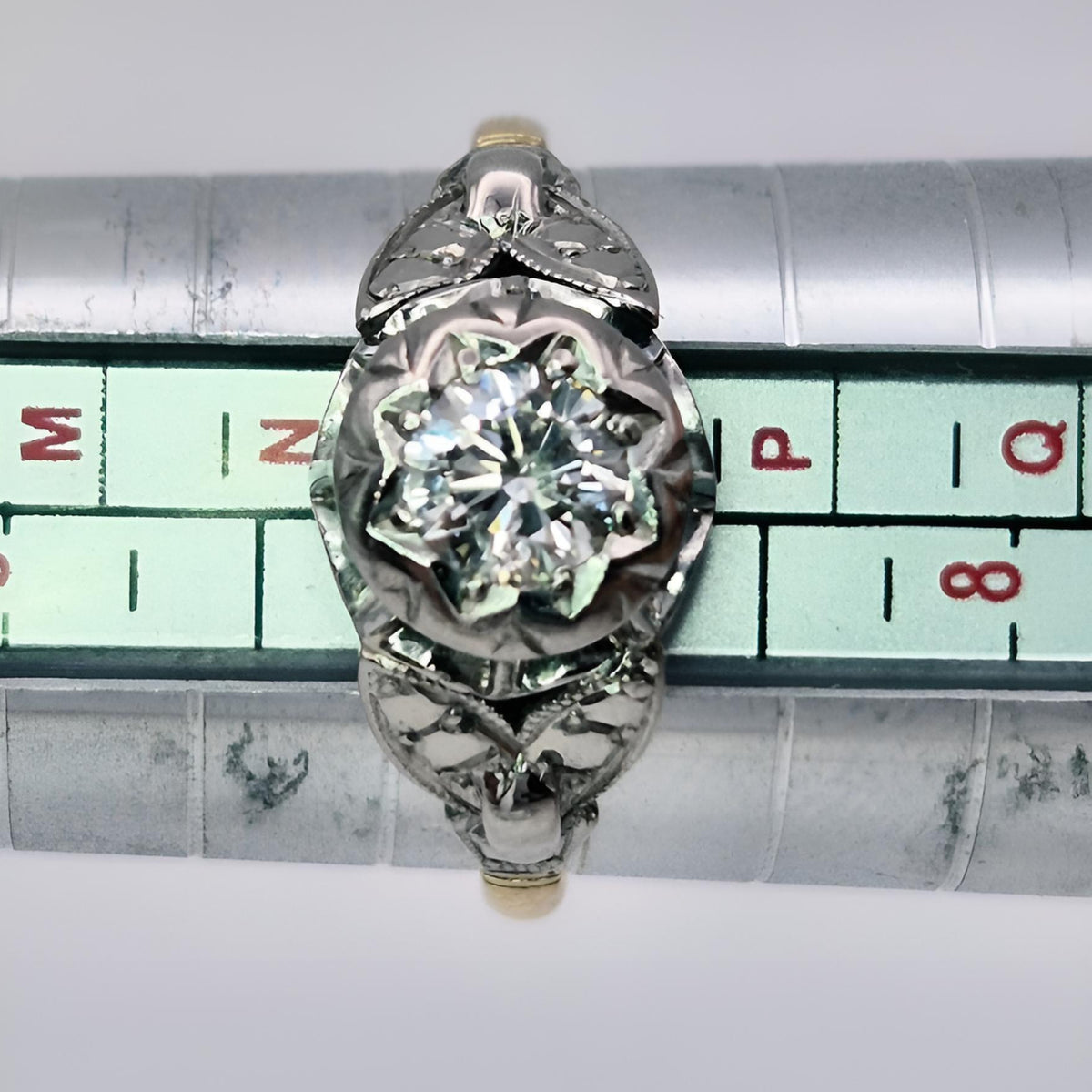 18ct yellow gold single stone diamond ring on ring stick