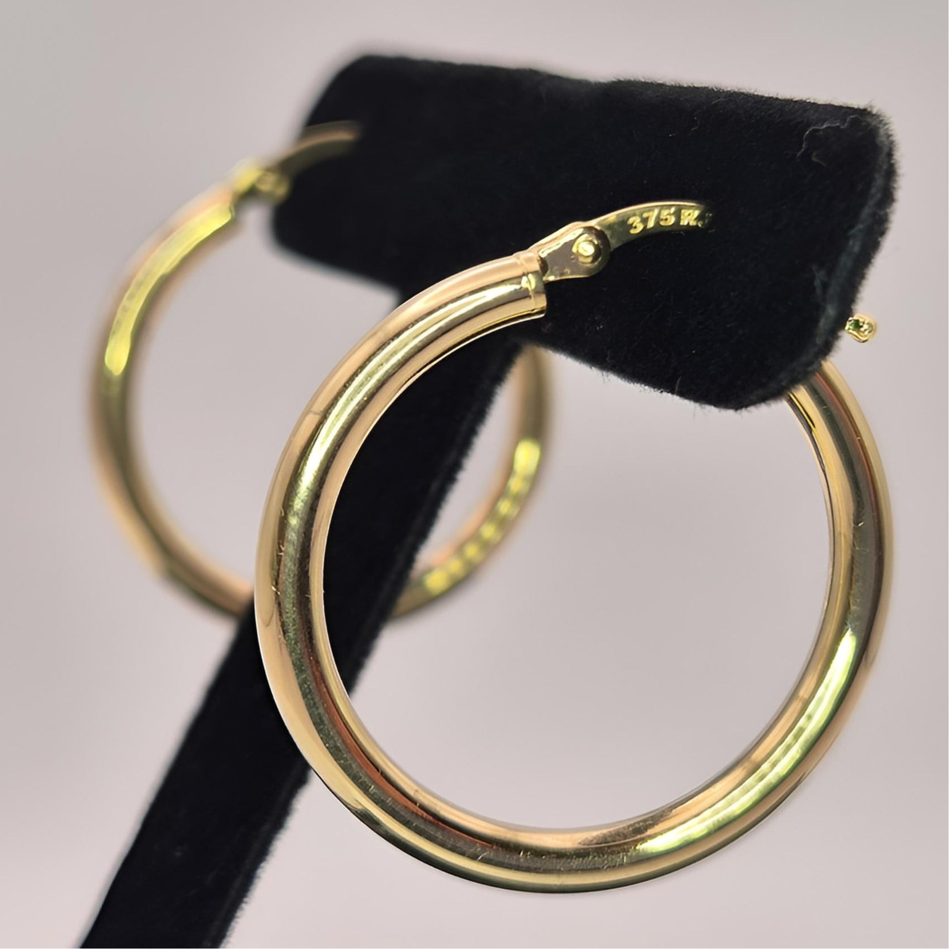 375 gold 20mm hoop earrings on display full left view