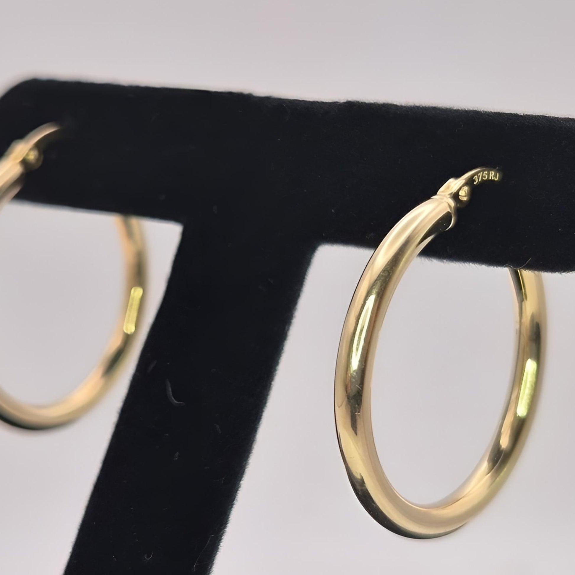 375 gold 20mm hoop earrings on display left view
