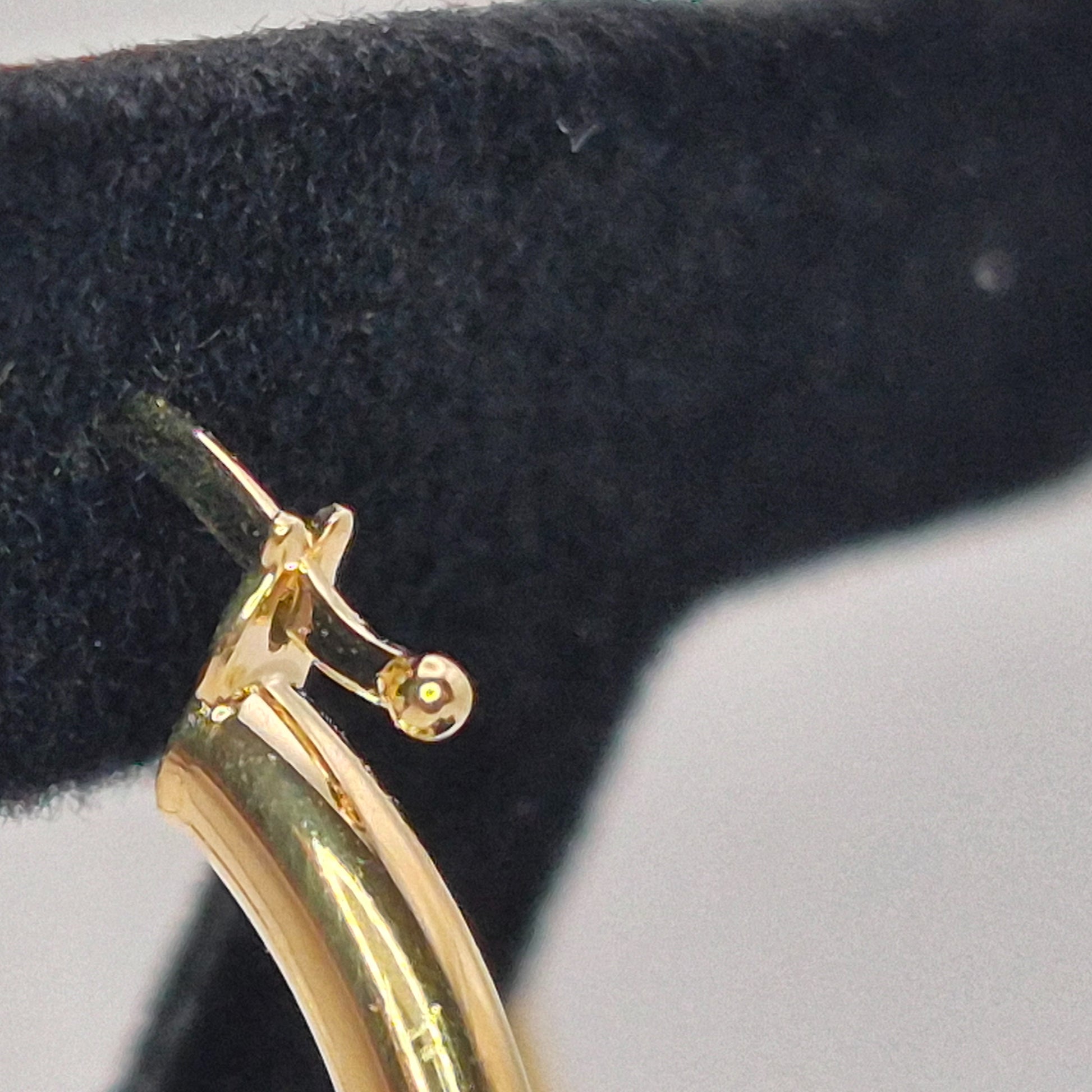 375 gold 20mm hoop earrings on display post