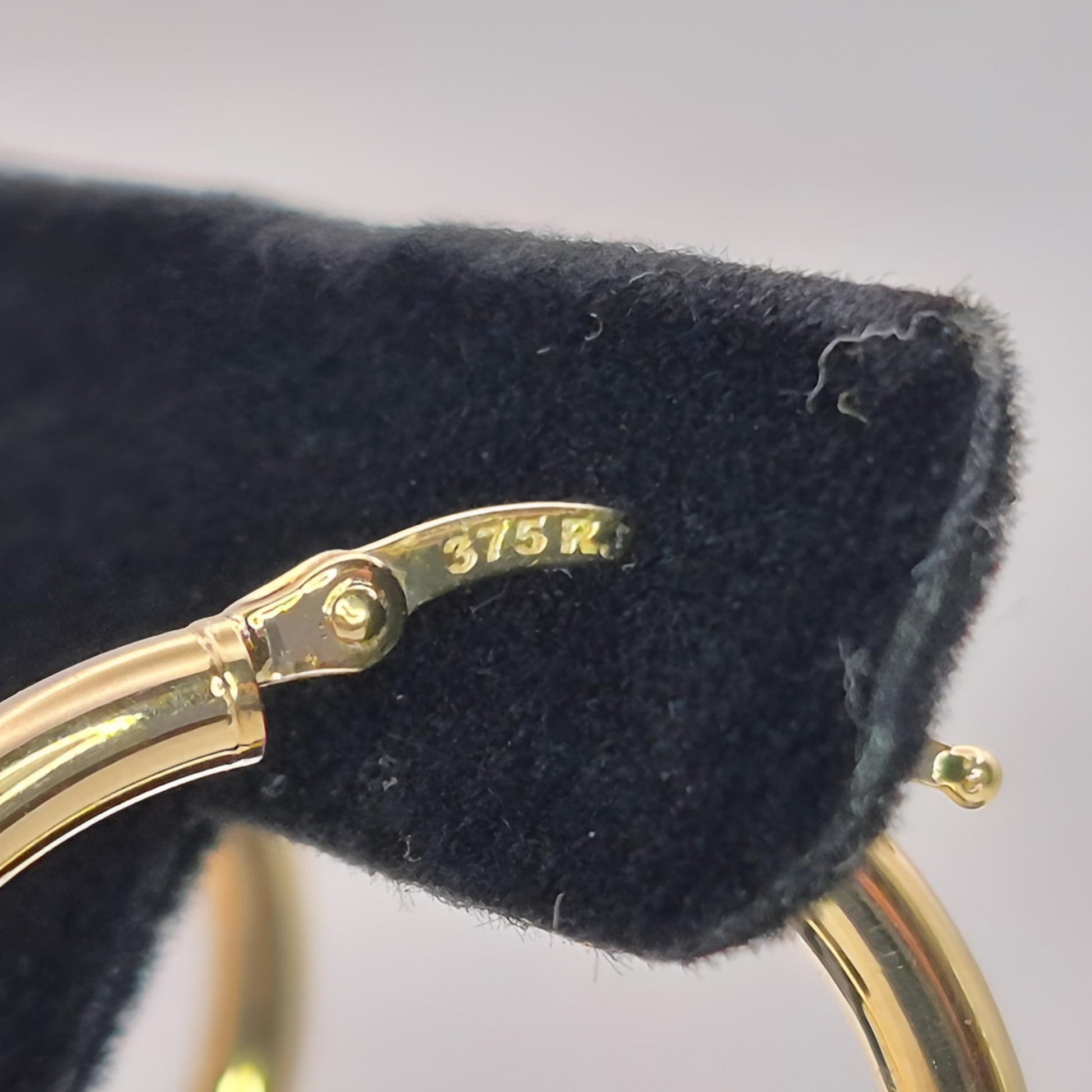 375 gold 20mm hoop earrings on display stamp 375
