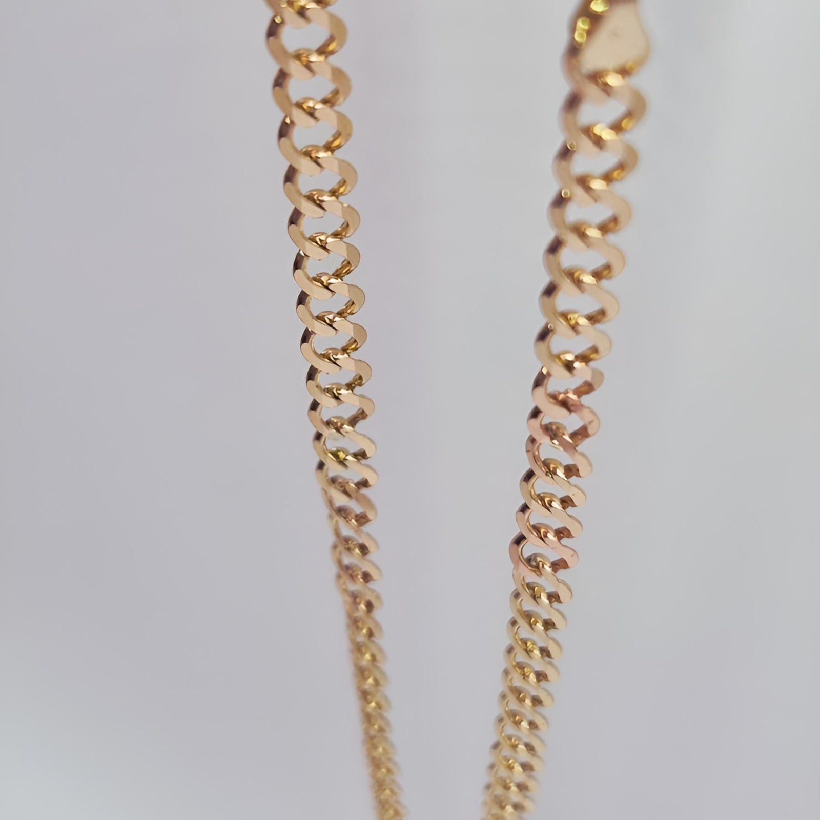 9ct Gold chain necklace on a light gray background