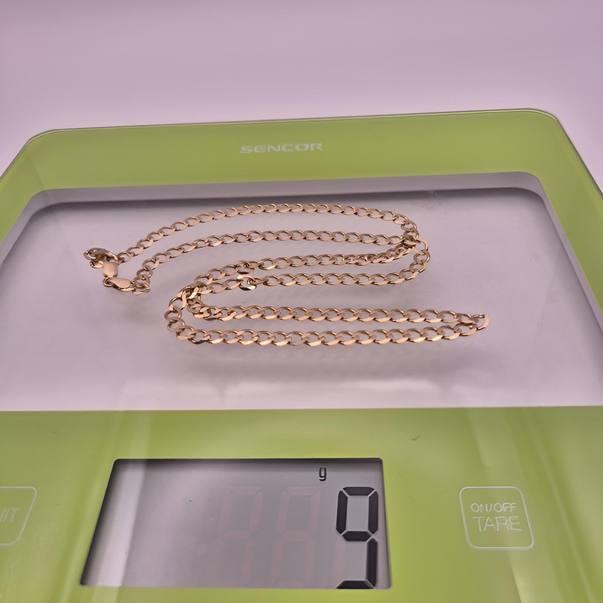 9ct yellow gold curb 22inch chain 4.5mm weight on scale