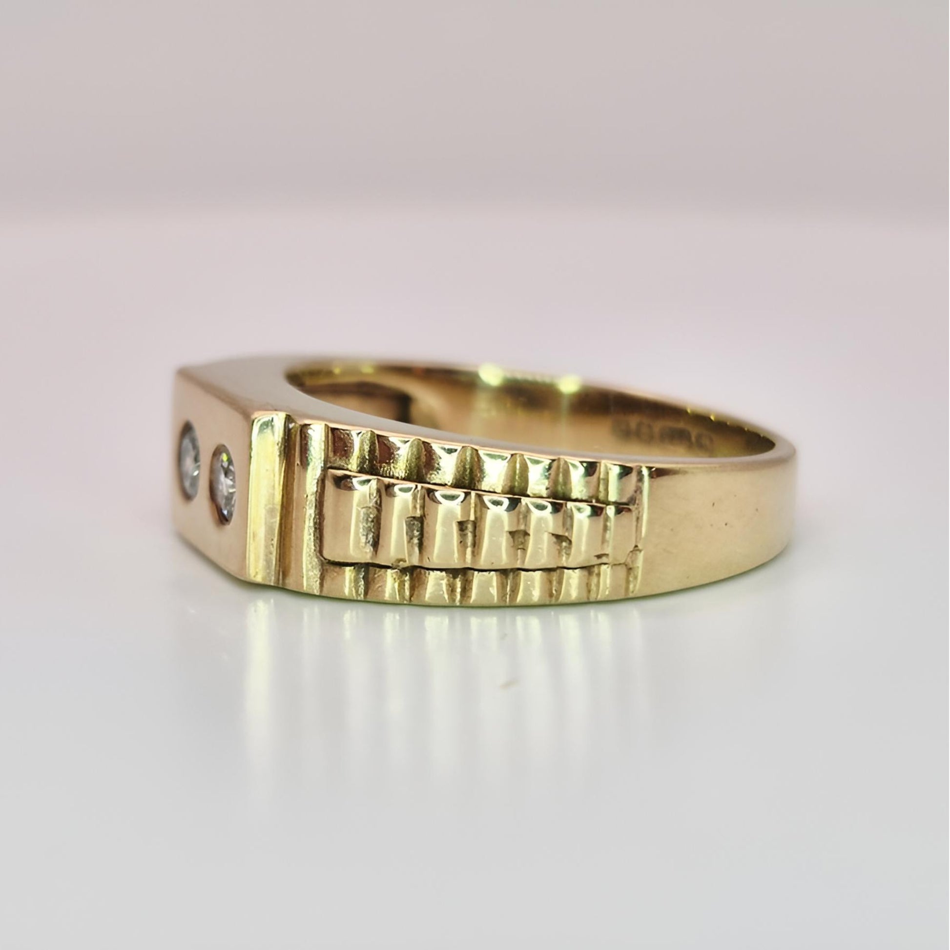 9ct yellow gold hallmarked two stone diamond ring on ring from left side view