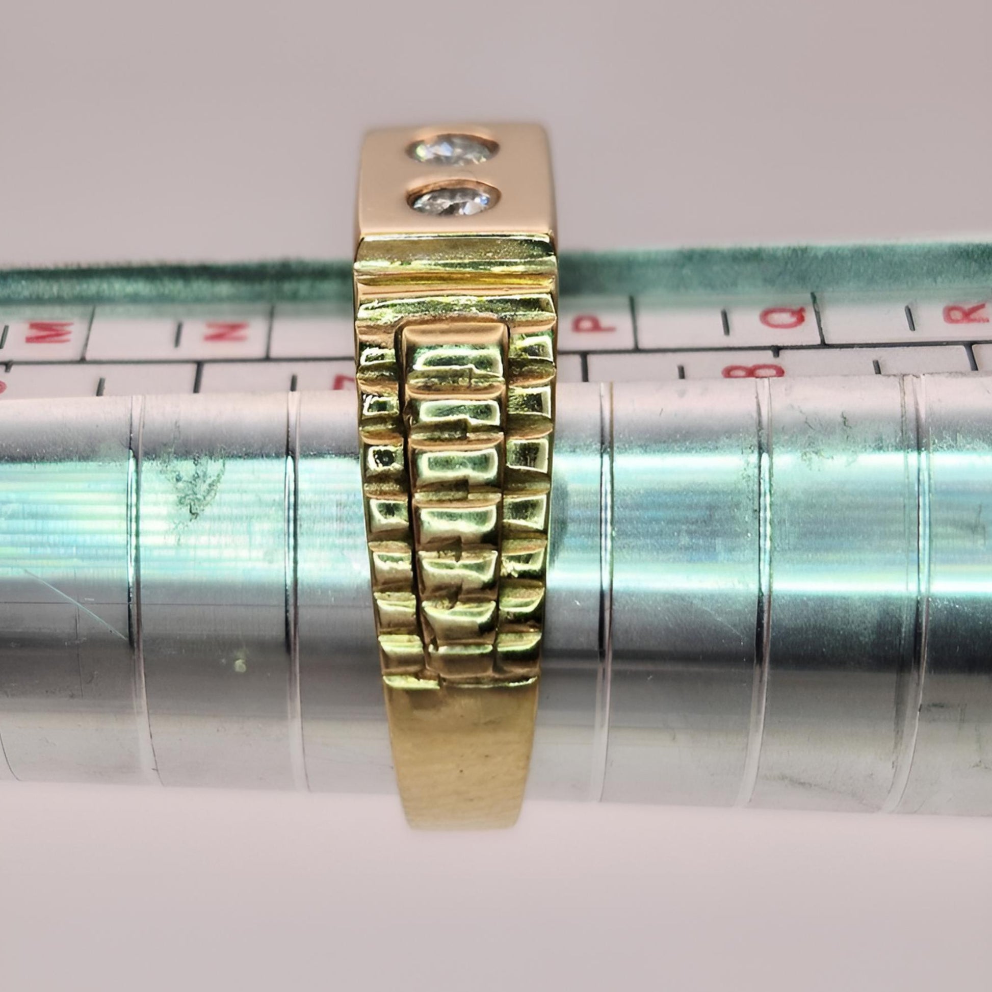 9ct yellow gold hallmarked two stone diamond ring on ring stick side view