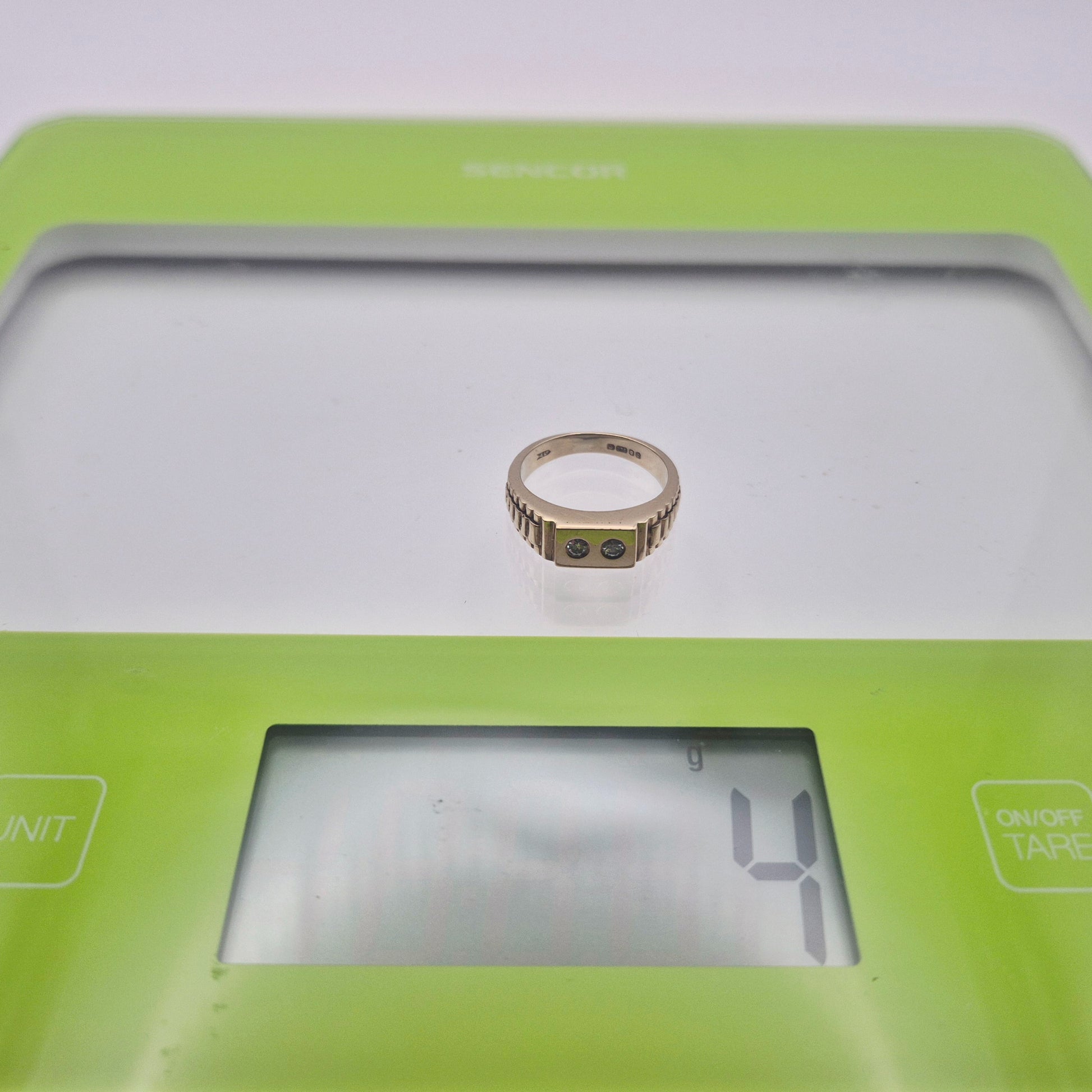 9ct yellow gold two stone diamond ring on scale