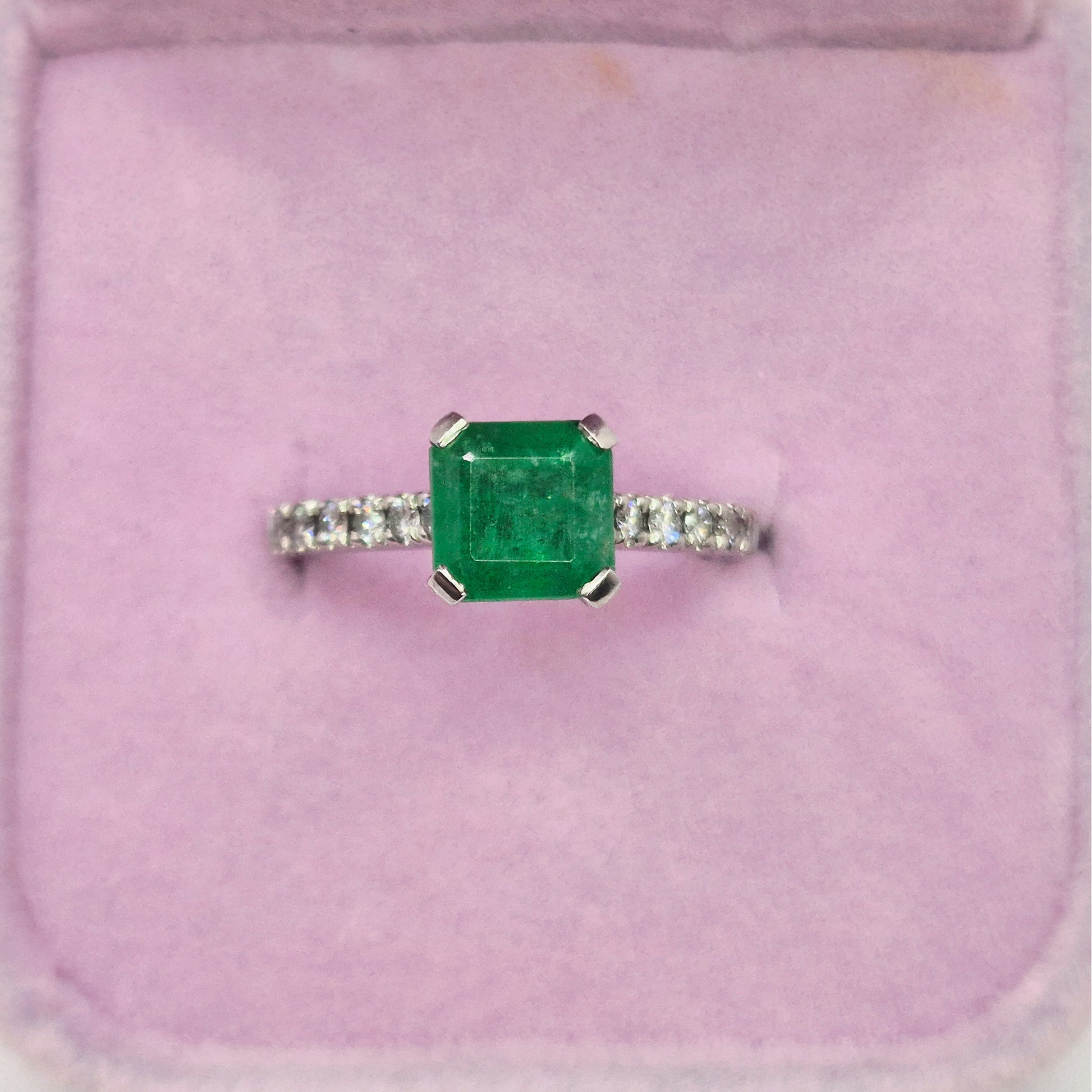 buish green emerald ring above view in box