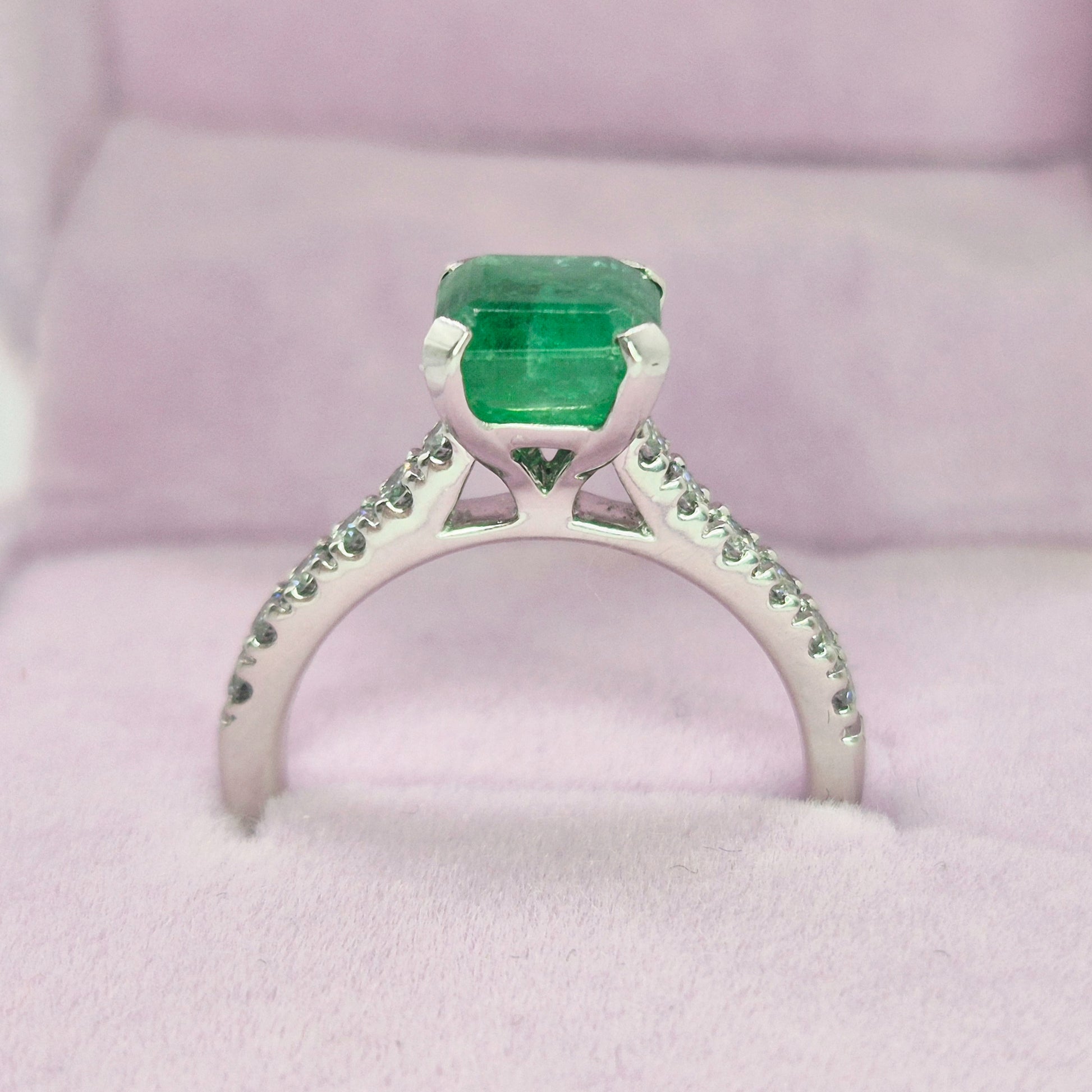 buish green emerald ring side view in box