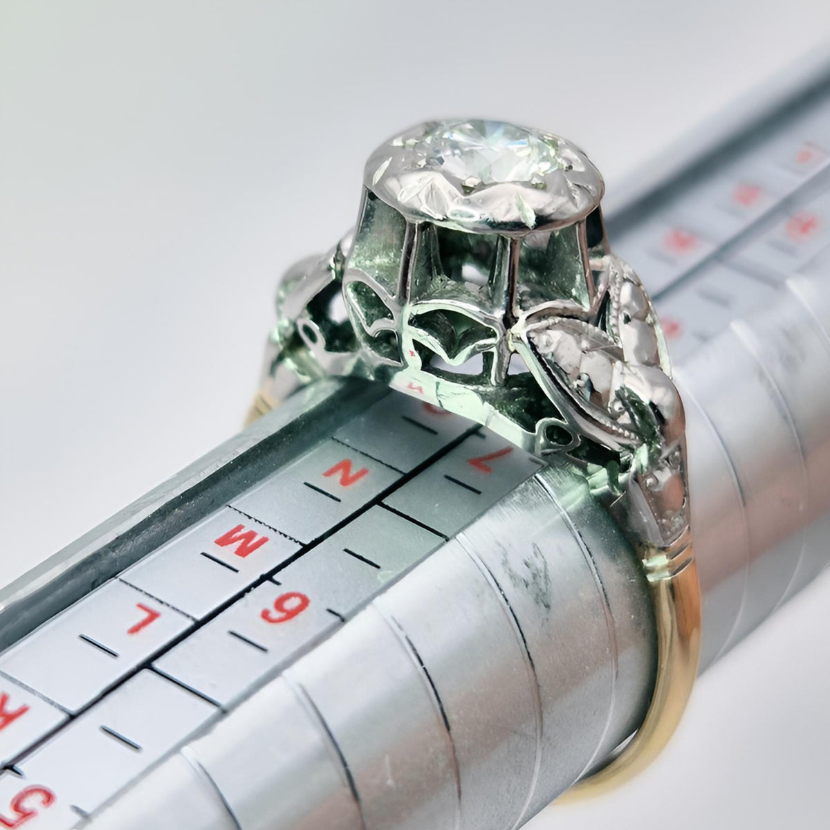 hallmarked 18ct yellow gold and platinum collet single stone diamond ring on ring stick