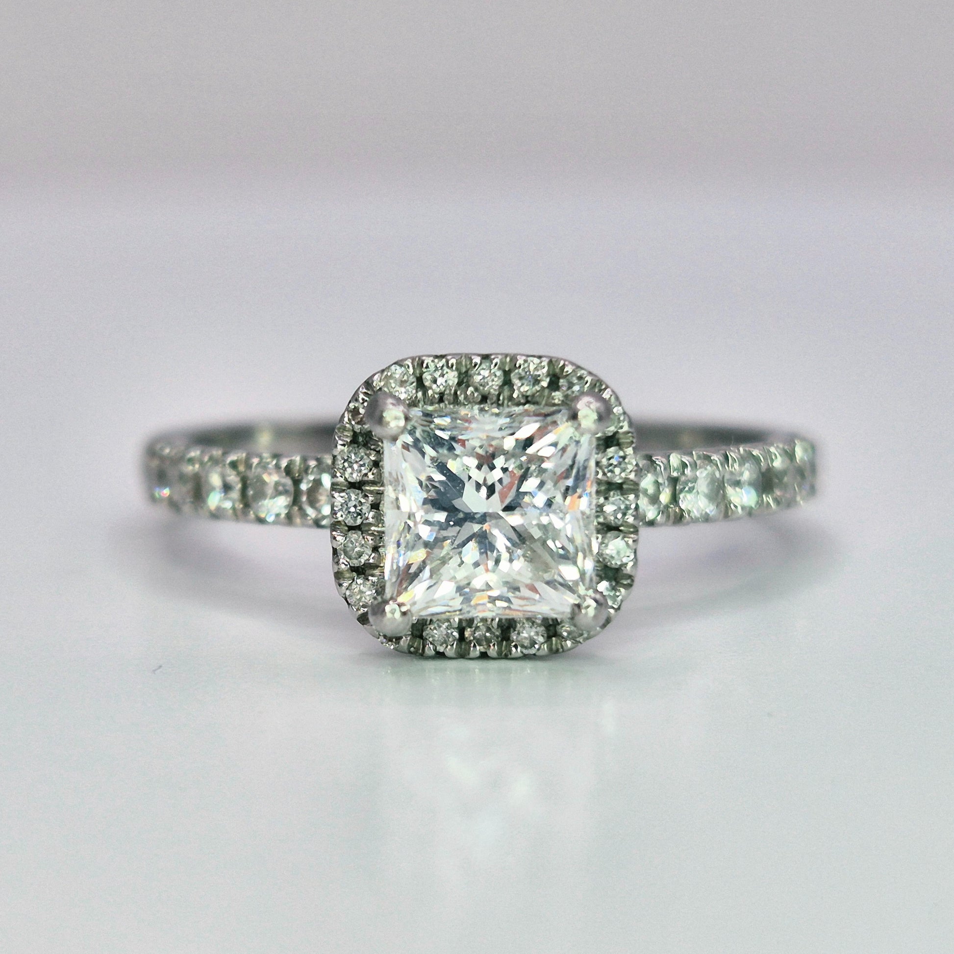platinum diamond halo diamond set collet and diamond set shoulder ring front view