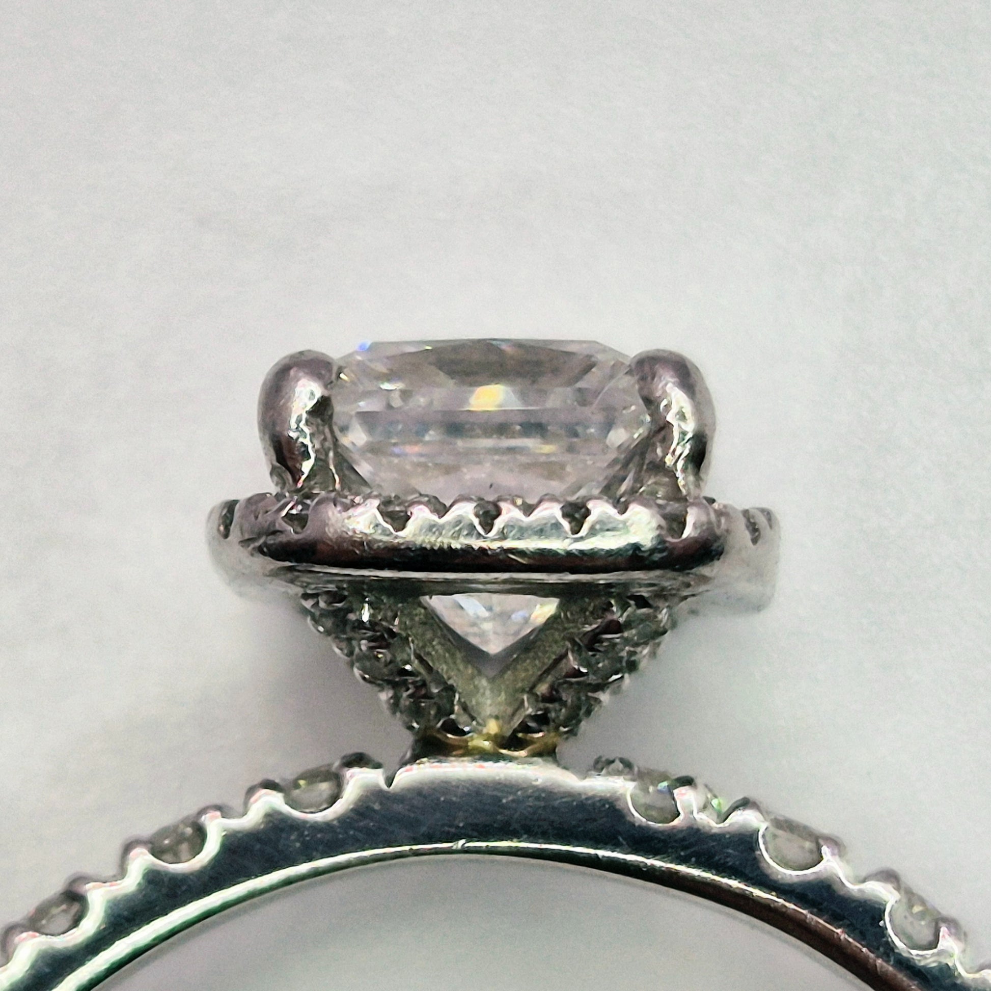 platinum diamond halo diamond set collet and diamond set shoulders ring collet close view