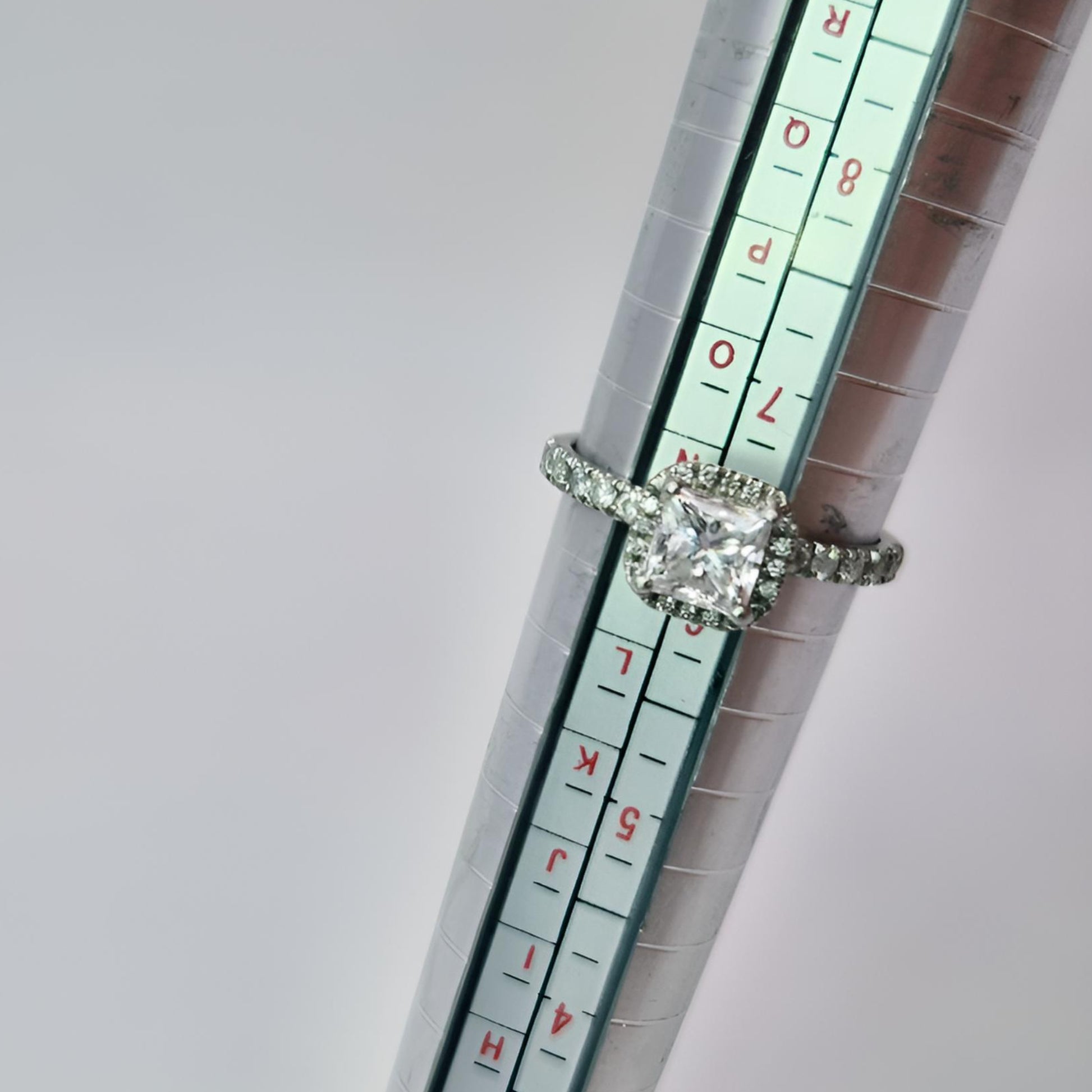platinum diamond halo diamond set collet and diamond set shoulders ring on ring stick n and half