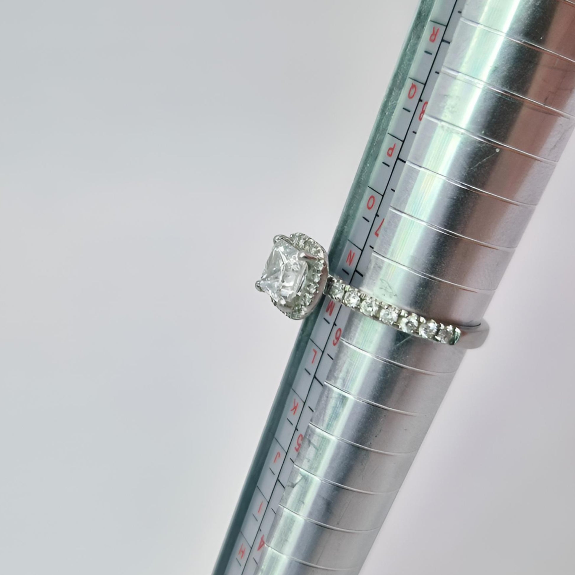 platinum diamond halo diamond set collet and diamond set shoulders ring on ring stick n half