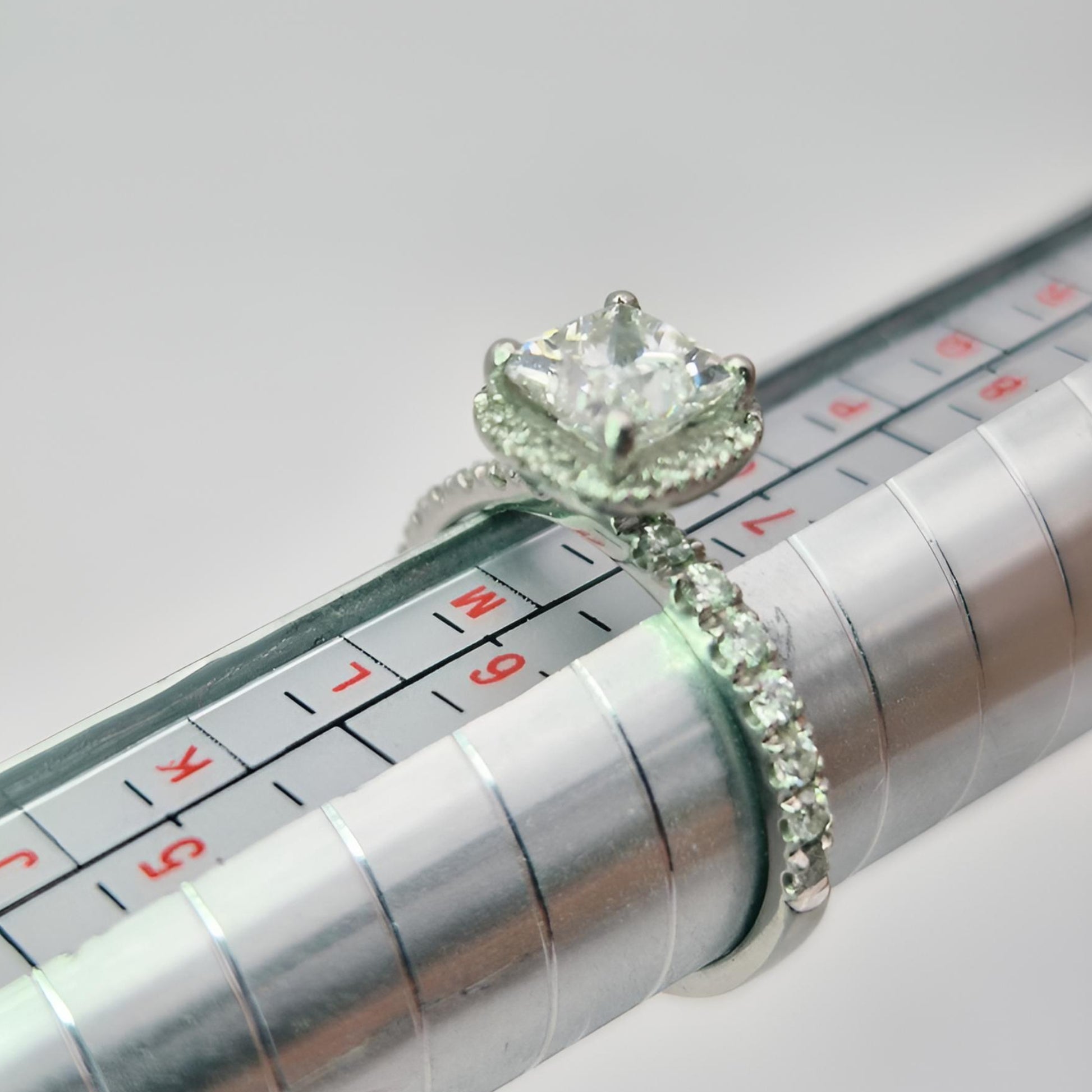 platinum diamond halo diamond set collet and diamond set shoulders ring on ring stick