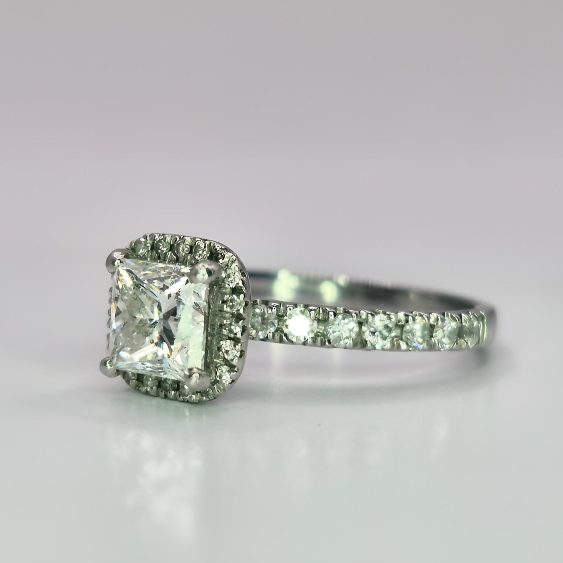 platinum diamond halo diamond set collet and diamond set shoulders ring side view