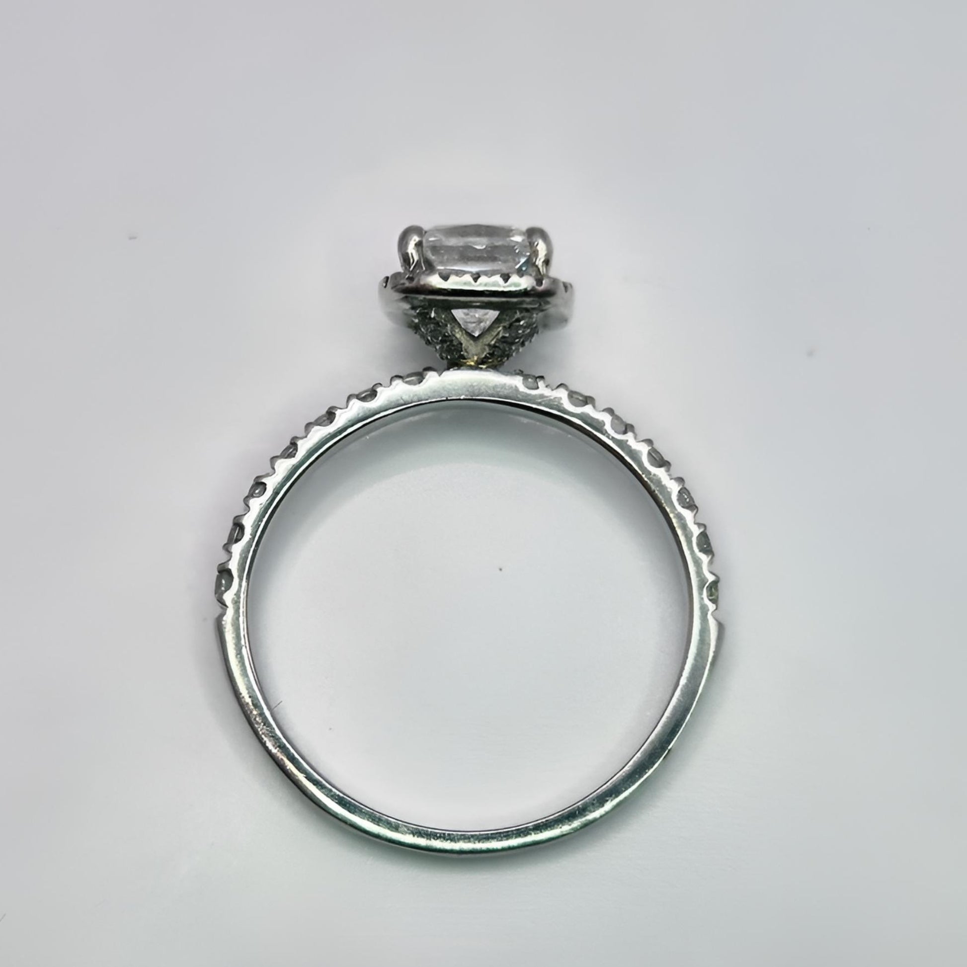 platinum diamond halo diamond set collet and shoulder ring above