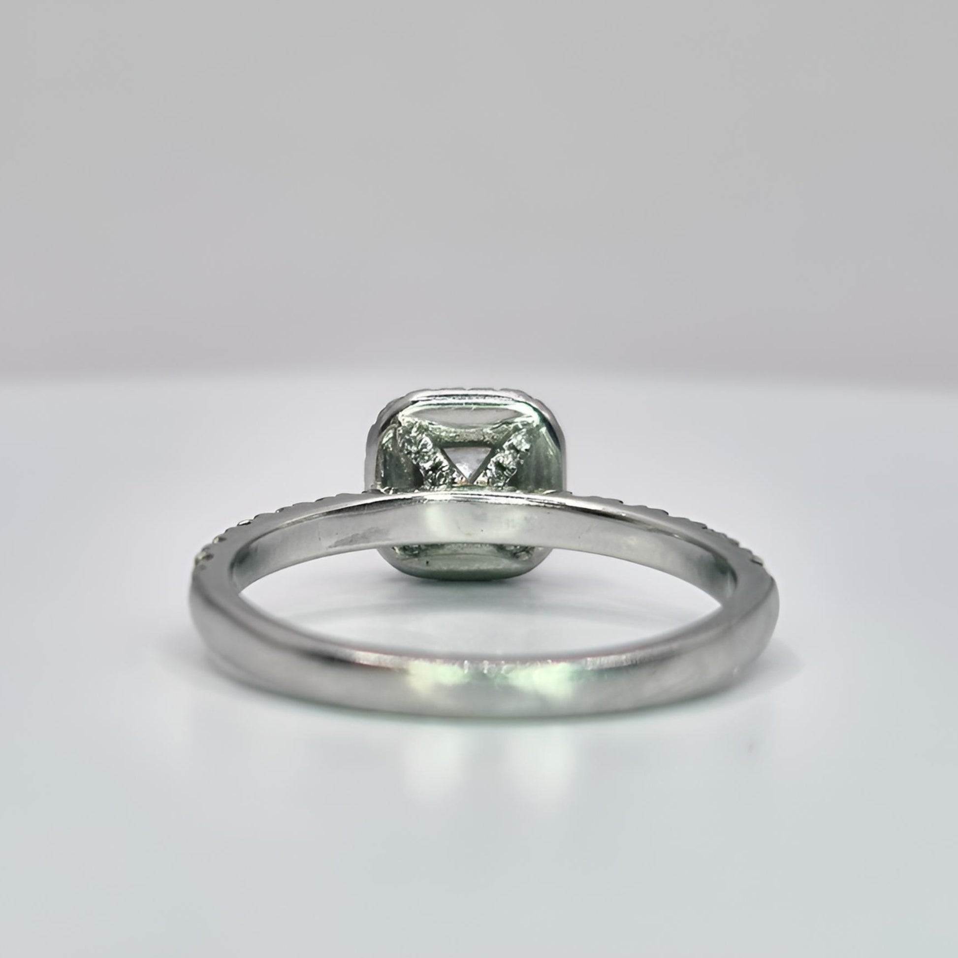 platinum diamond halo diamond set collet and shoulder ring behind collet view