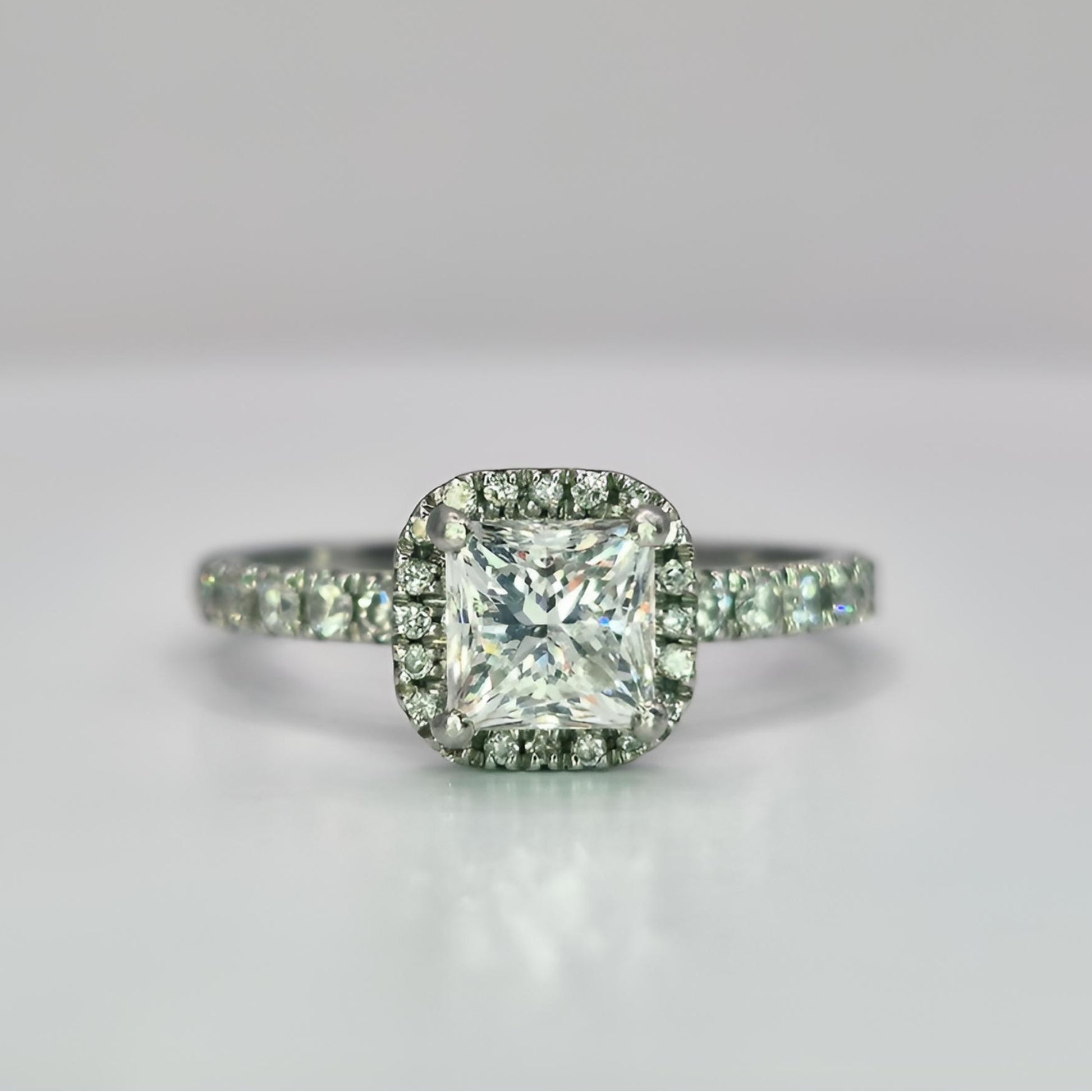 platinum diamond halo diamond set collet and shoulder ring front view