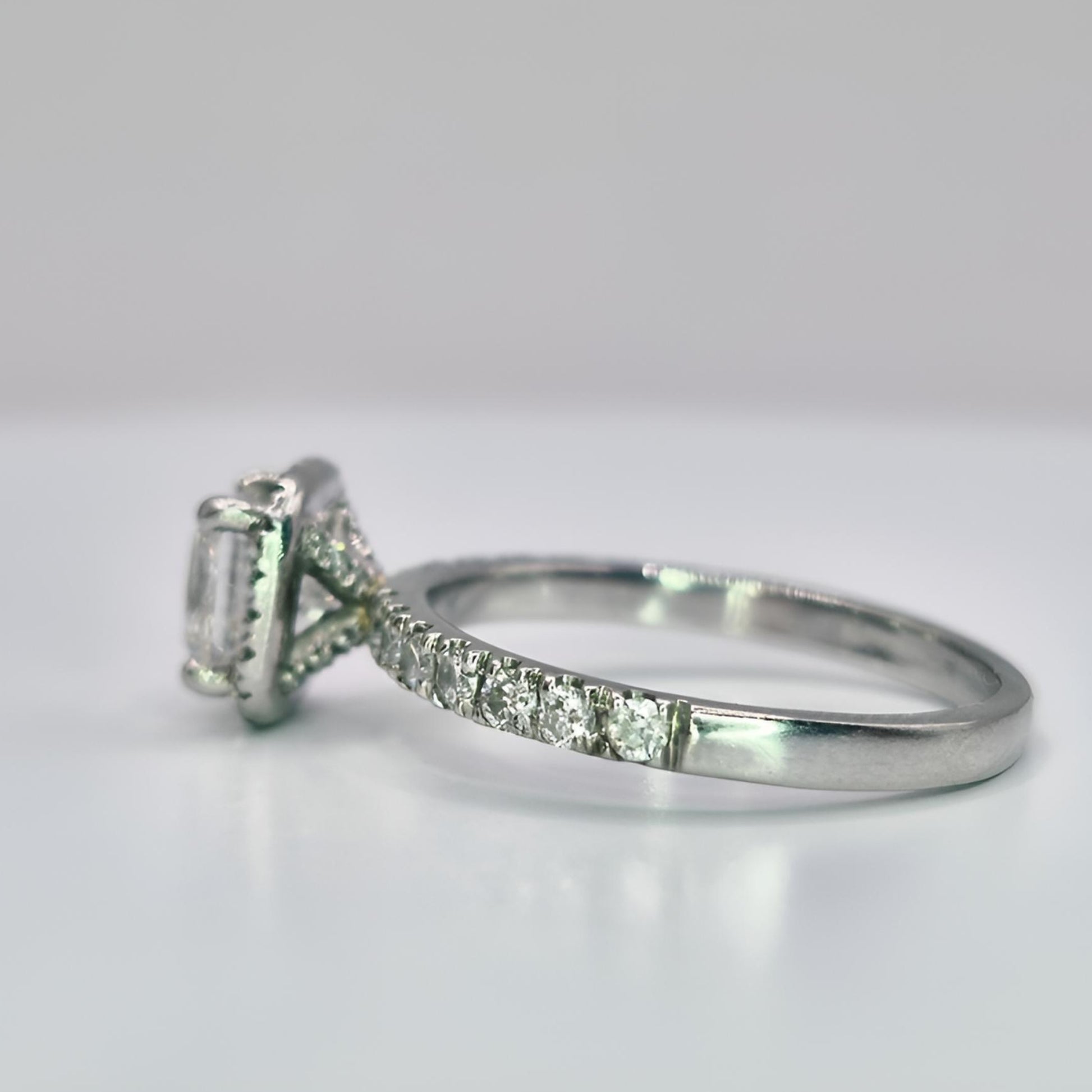 platinum diamond halo diamond set collet and shoulder ring left side view
