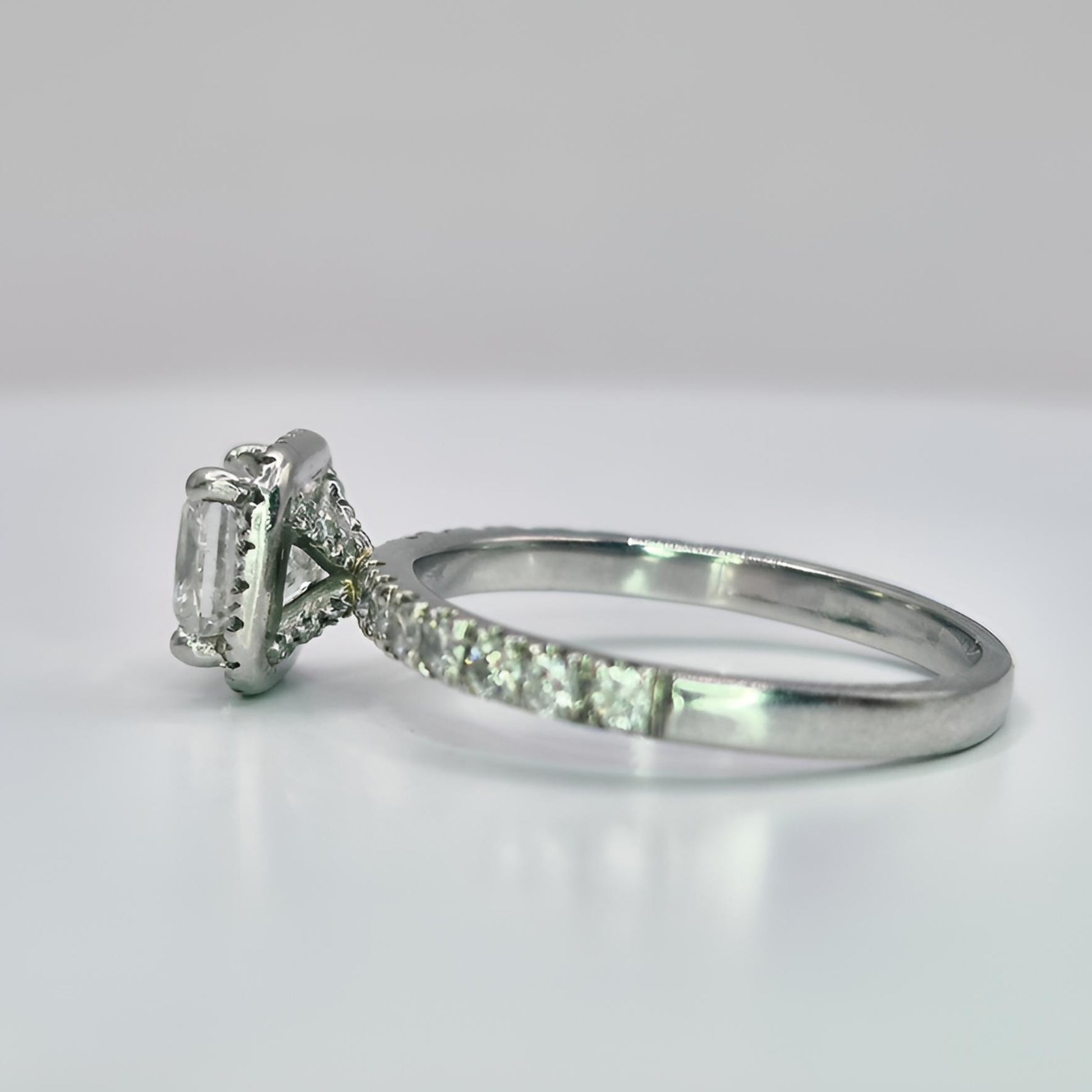 platinum diamond halo diamond set collet and shoulder ring left view