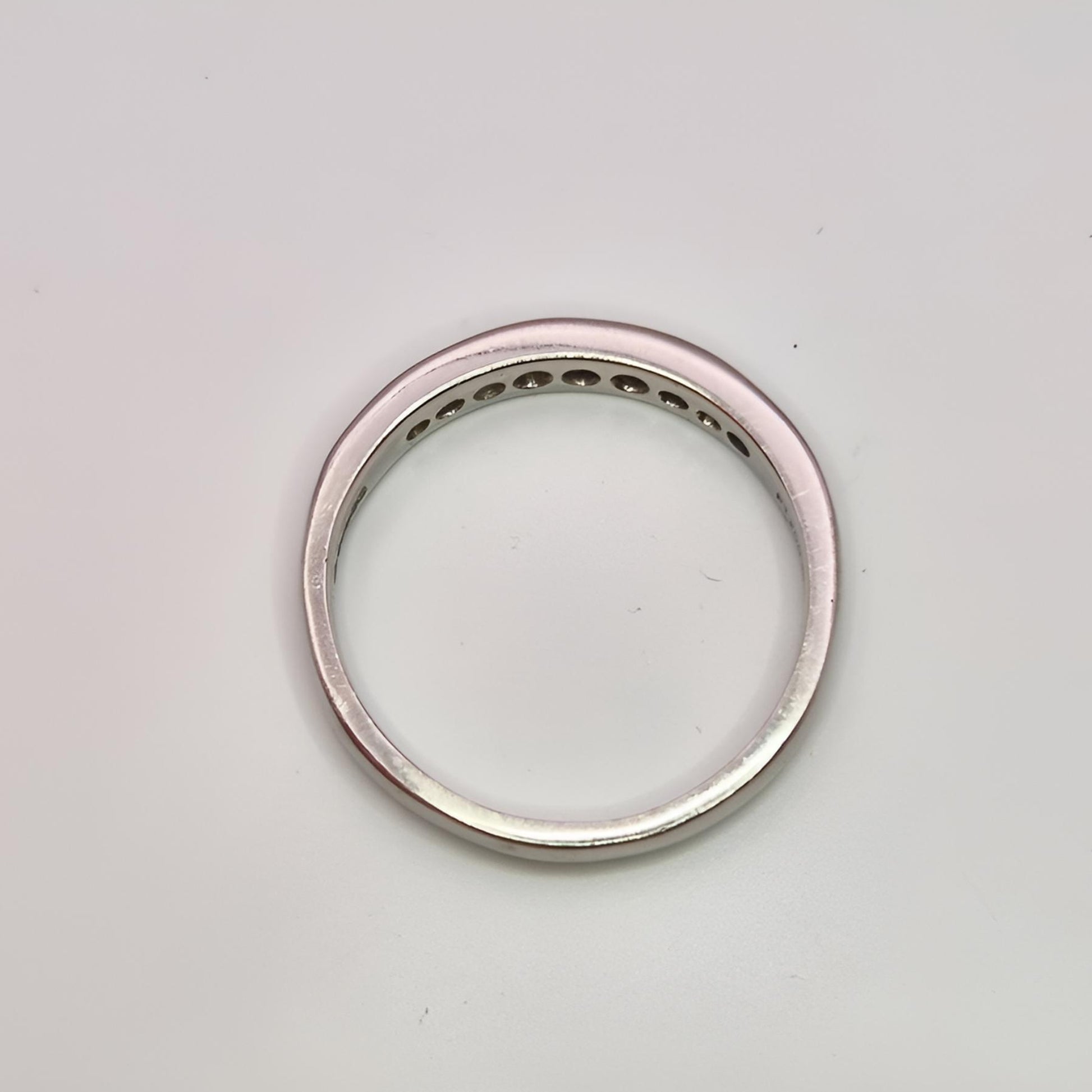 platinum hallmarked diamond half eternity ring above