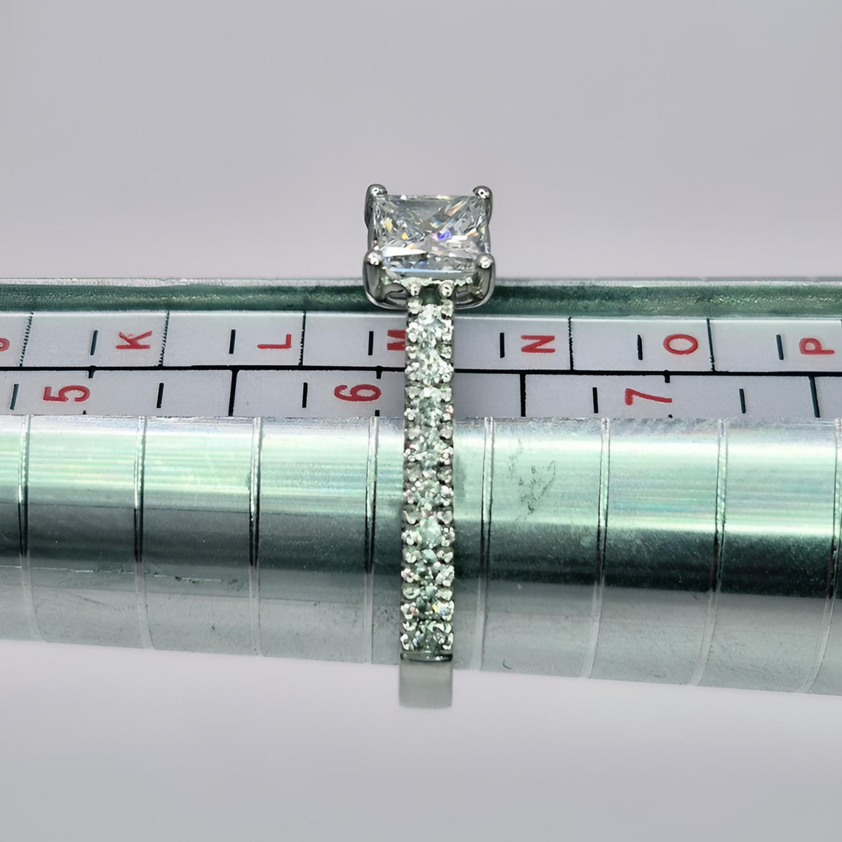 platinum princess cut single stone diamond shoulder ring on ring stick size m