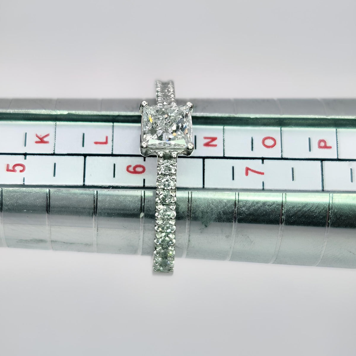platinum princess cut single stone diamond shoulder ring on ring stick