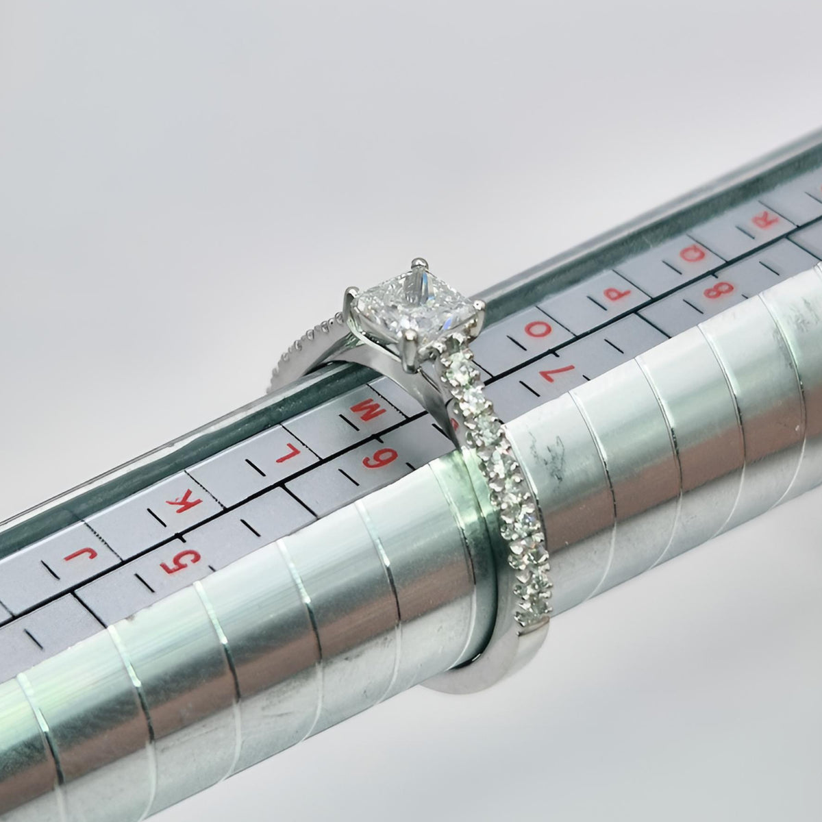 platinum princess cut single stone diamond shoulders ring on ring stick