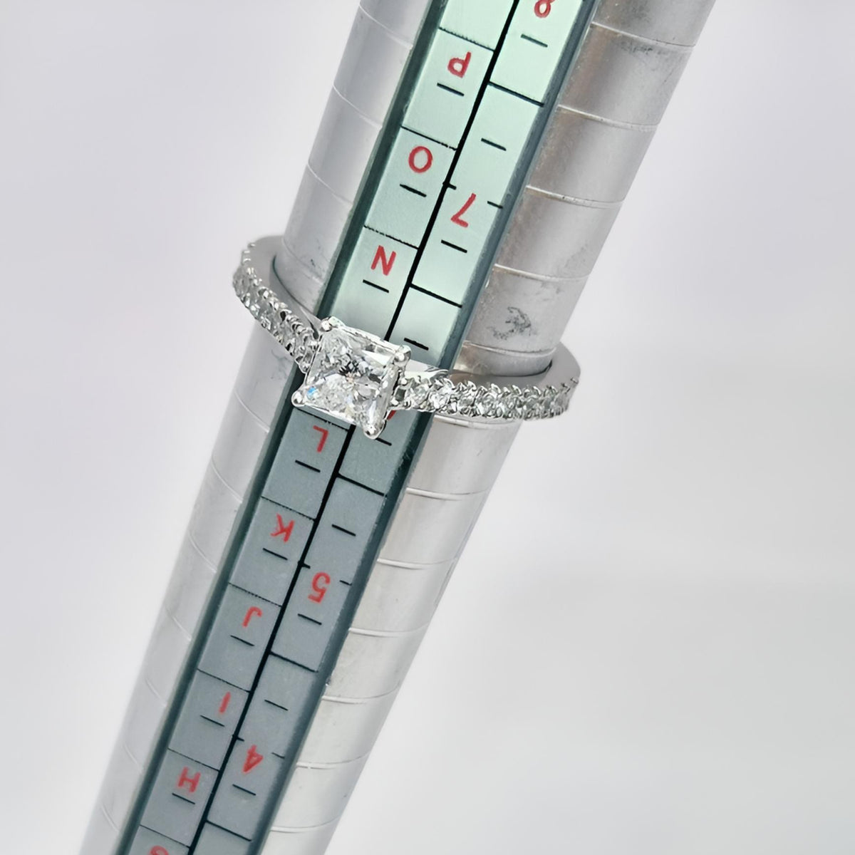 platinum princess cut single stone diamond shoulders ring on stick