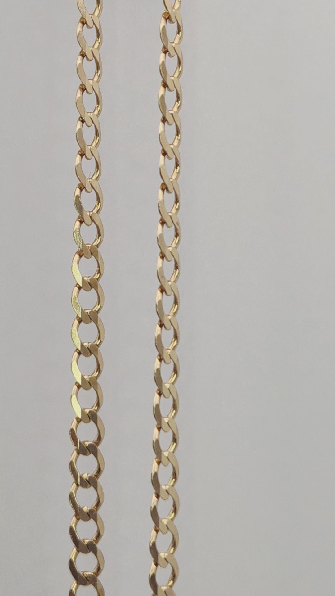 Close-up video of a 9ct yellow gold 22-inch curb chain showing the 4.5mm wide solid links and a secure lobster clasp.