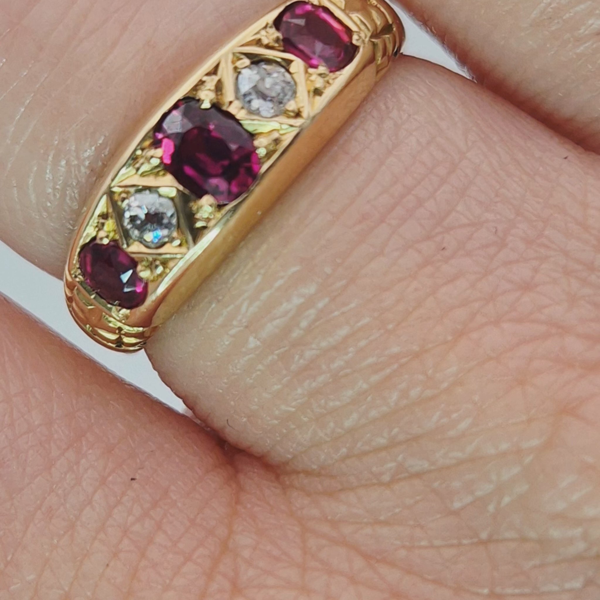 18ct yellow gold ruby and diamond 5 stone scroll ring video on finger