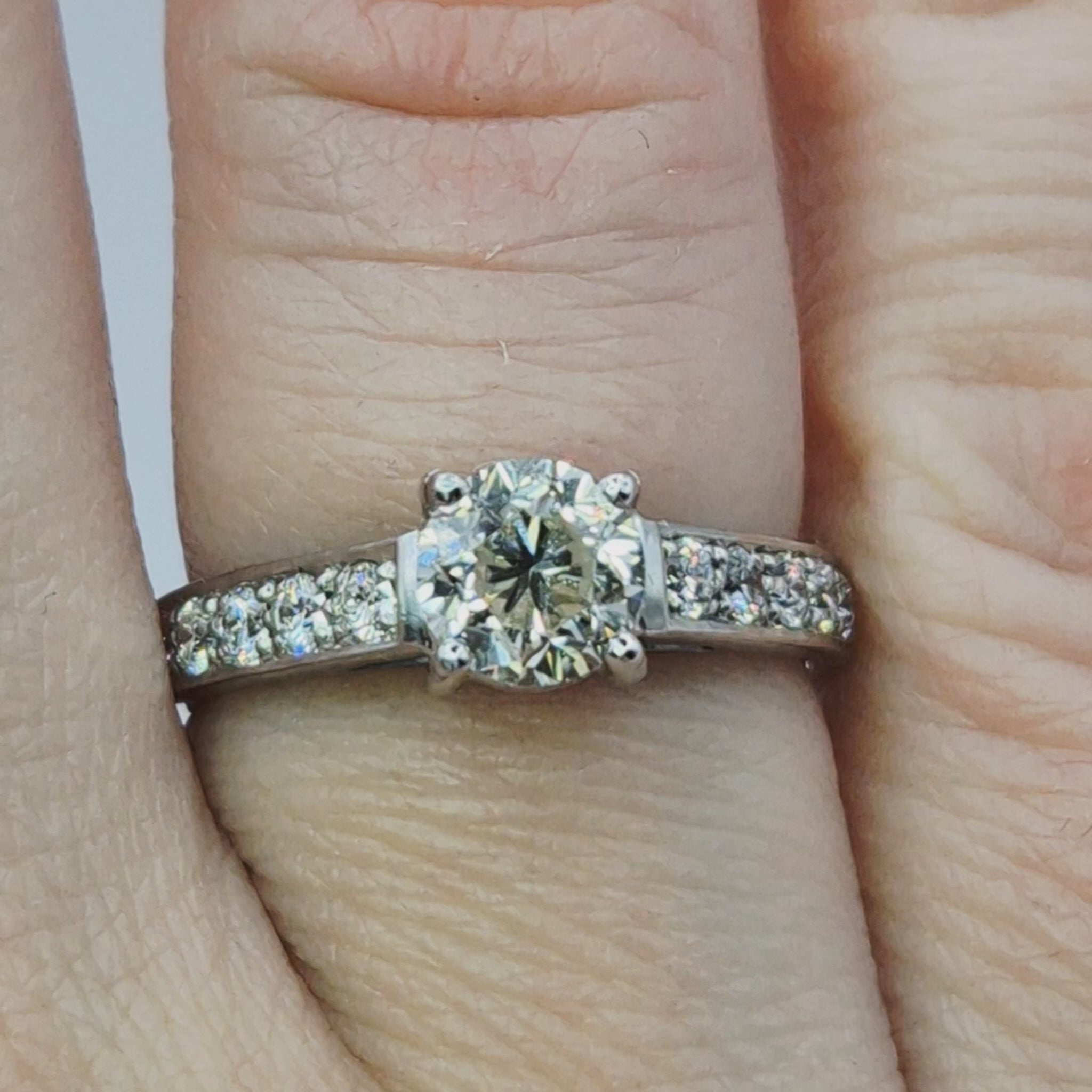 18ct white gold single stone diamond shoulders ring on ring finger video