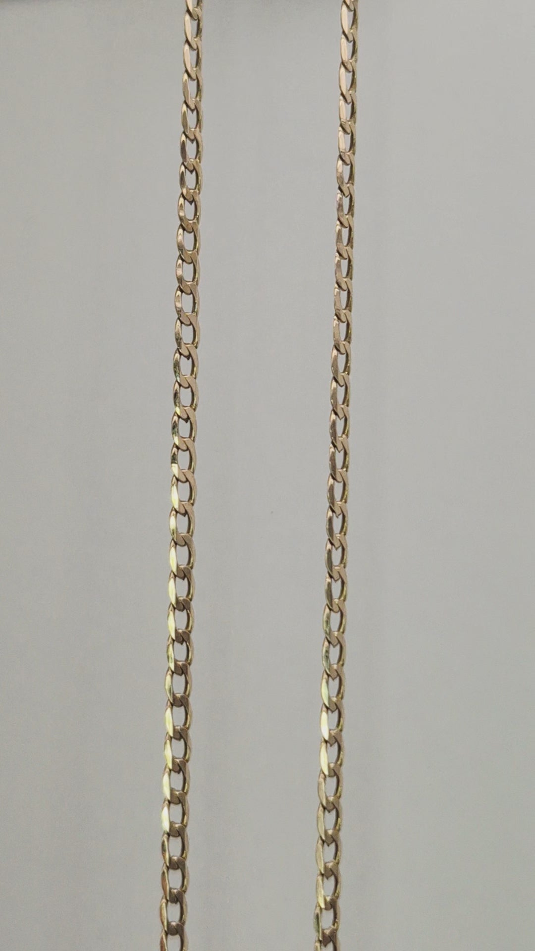 Close-up video of a 9ct yellow gold 18-inch angle filed curb chain showing high-polish links and sparkle.